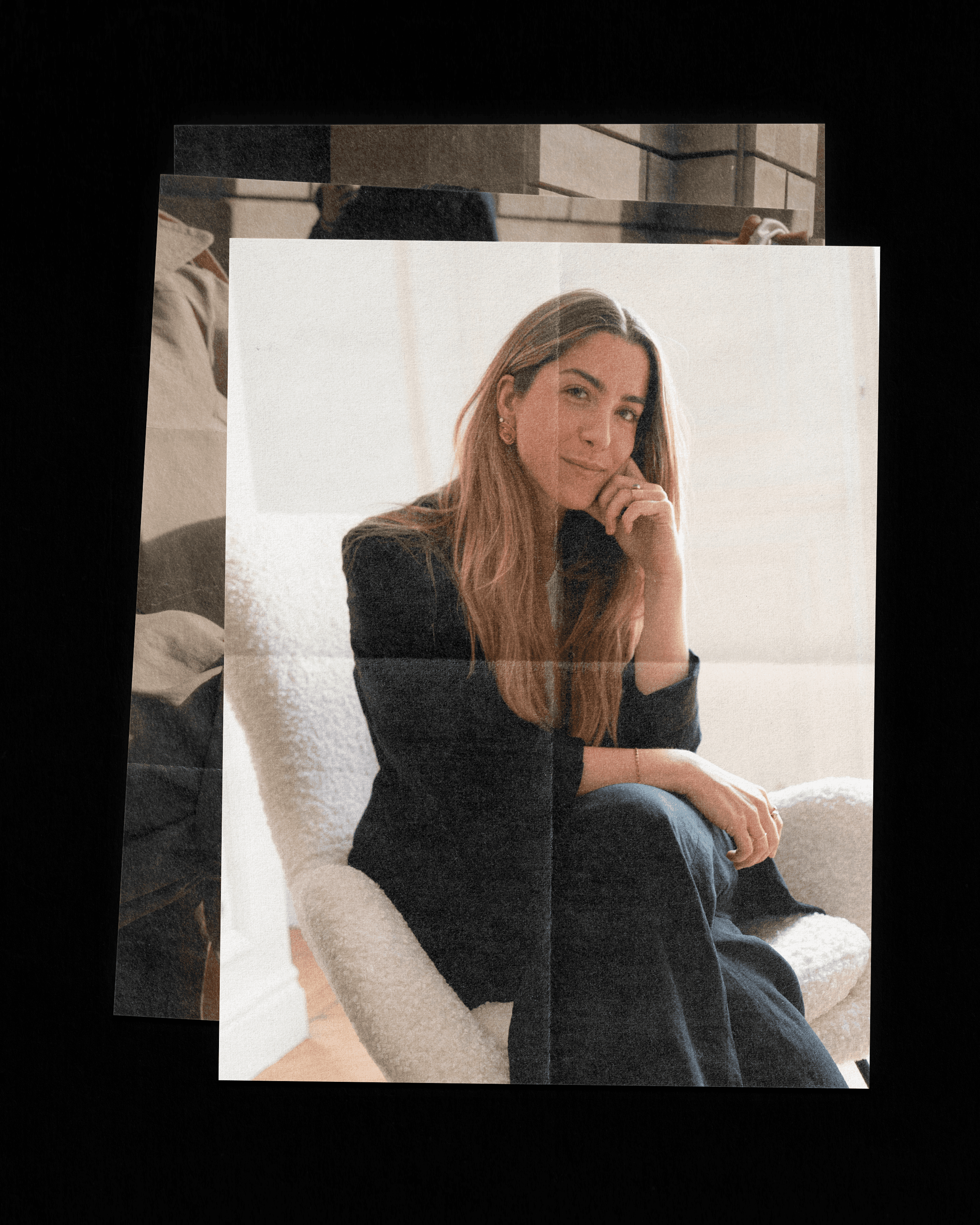 A view of a studio interior with modern decor, featuring large windows that offer a glimpse of lush greenery outside