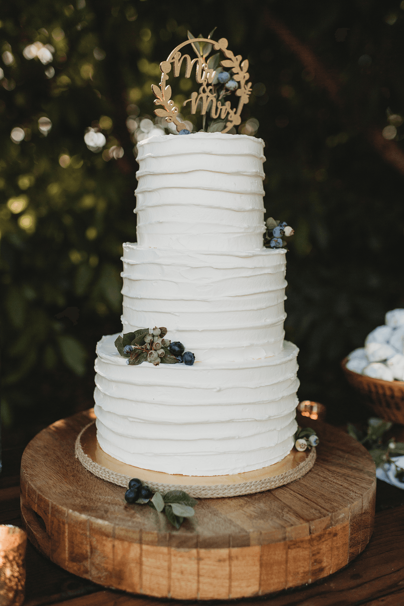 Dessert table and cake detail photo with chandelier above