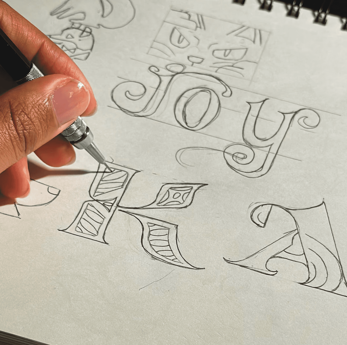 A thoughtful young person with dark hair gazes to the side, captured in soft black and white lighting.