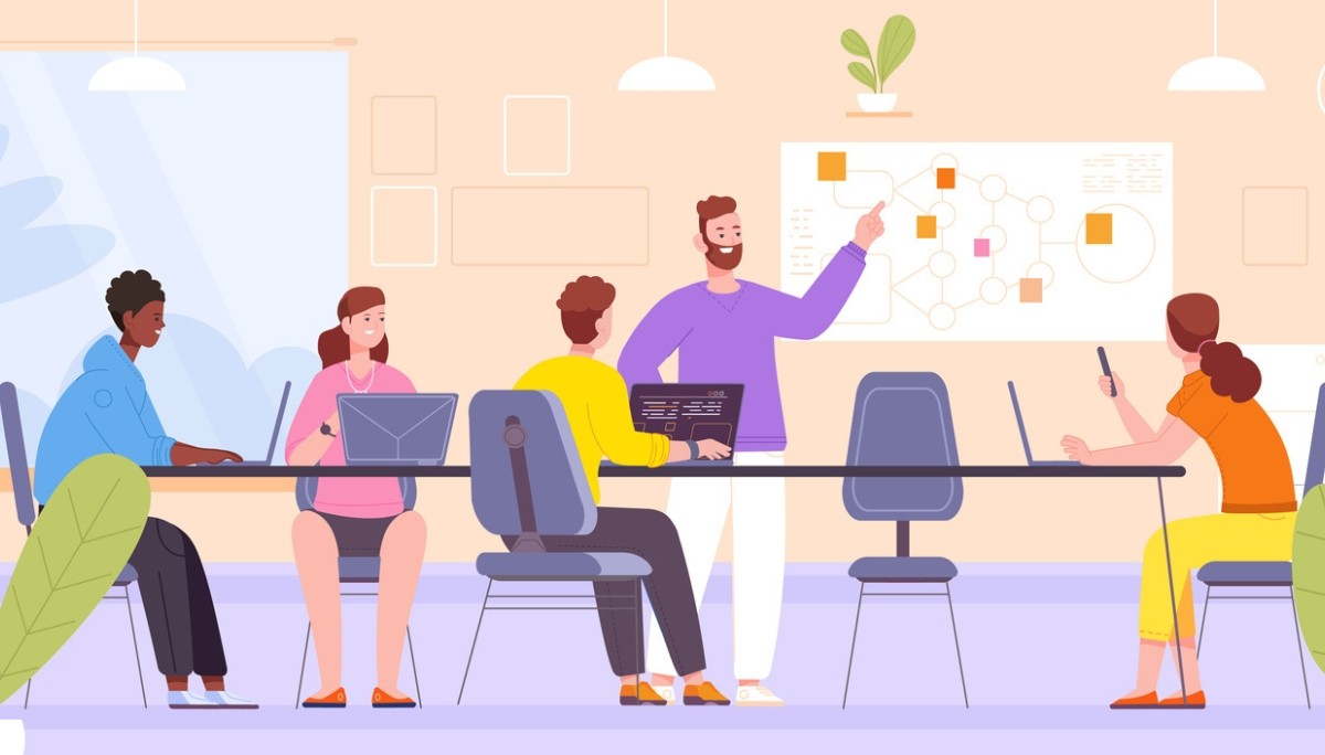 Illustration of a team gathered around a table in a modern meeting room, collaborating while one person presents a flowchart on a whiteboard, representing coding bootcamps, group learning, and the comparison of in‑person and online programs in 2026.
