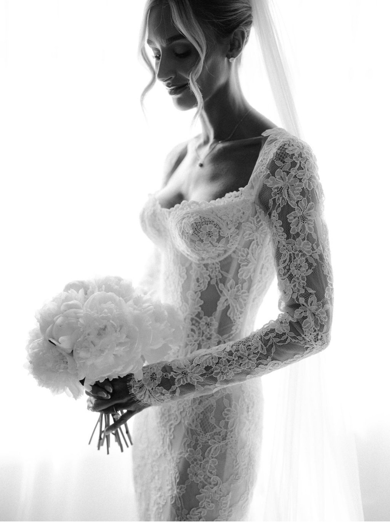An intimate bridal portrait with bouquet, makeup by Carla Rolli