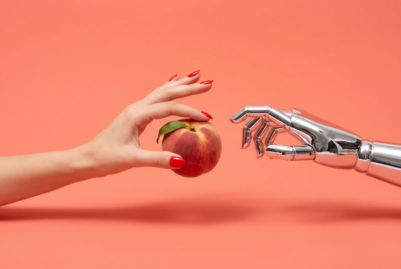 A human hand taking a peach back from a chrome robot hand, how to quit AI porn and AI companion apps