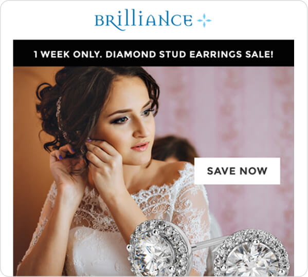 Woman putting on earrings
