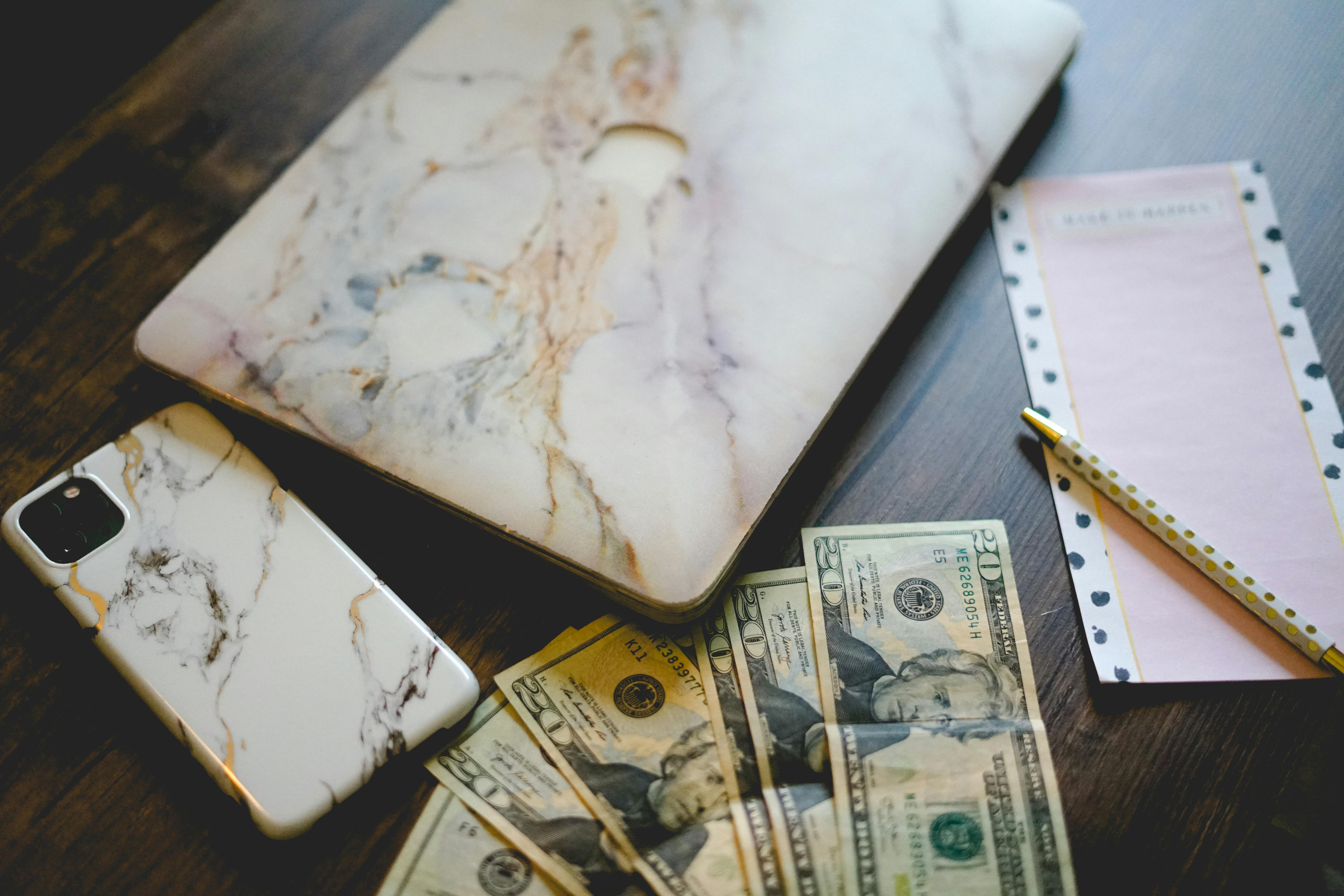 Gadgets and mortgage earnings on top of a wooden deck