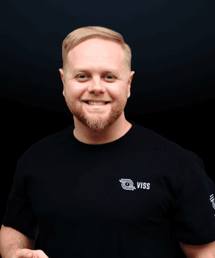 man standing beside wall