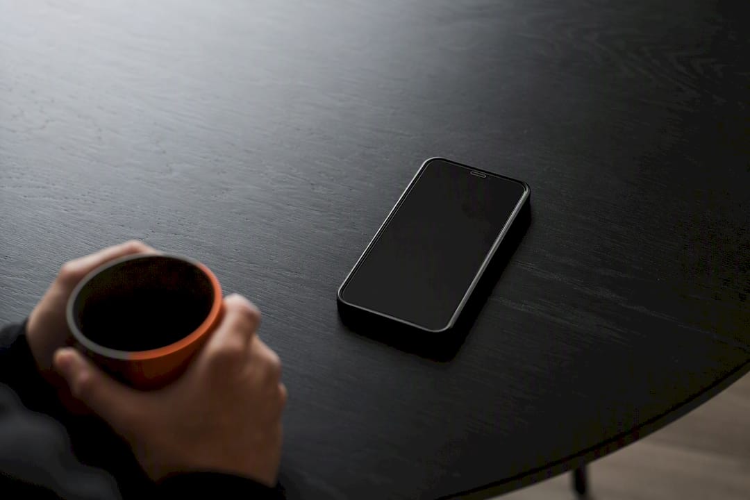 Calm scene with phone and drink during app error