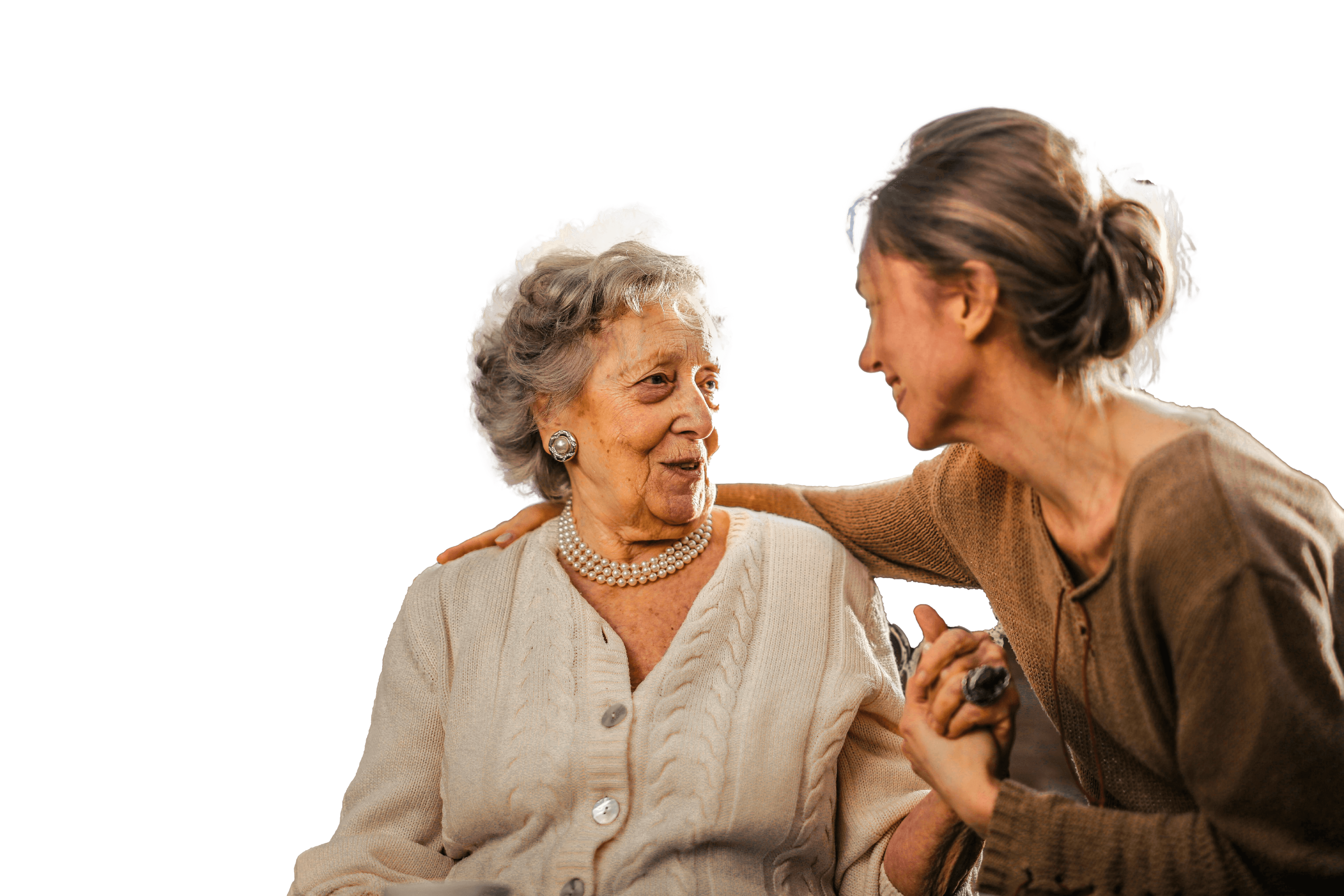 Elderly woman speaking with caregiver about applying for benefits using Barnab.