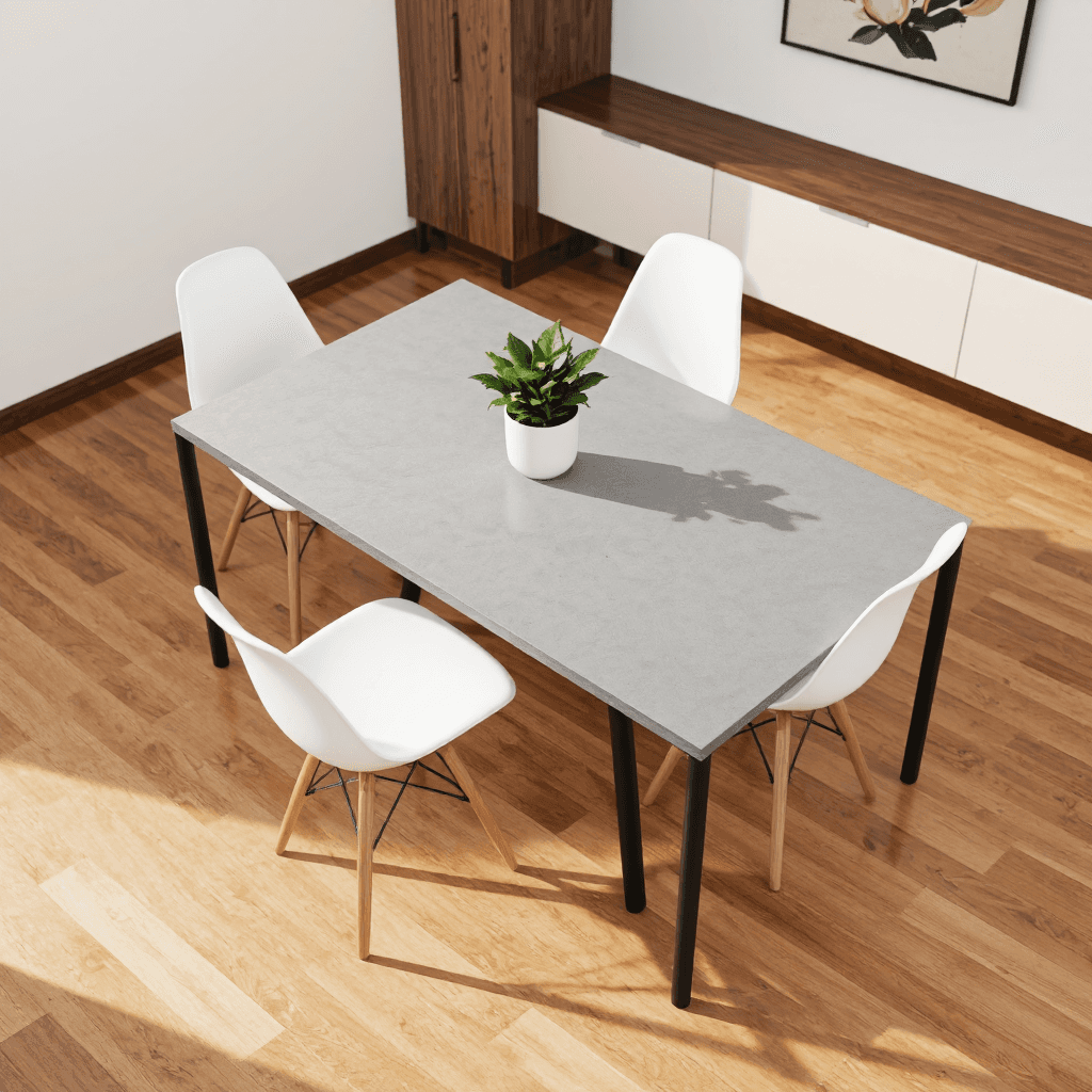 product photography of a dining table with four chairs and a small plant on top