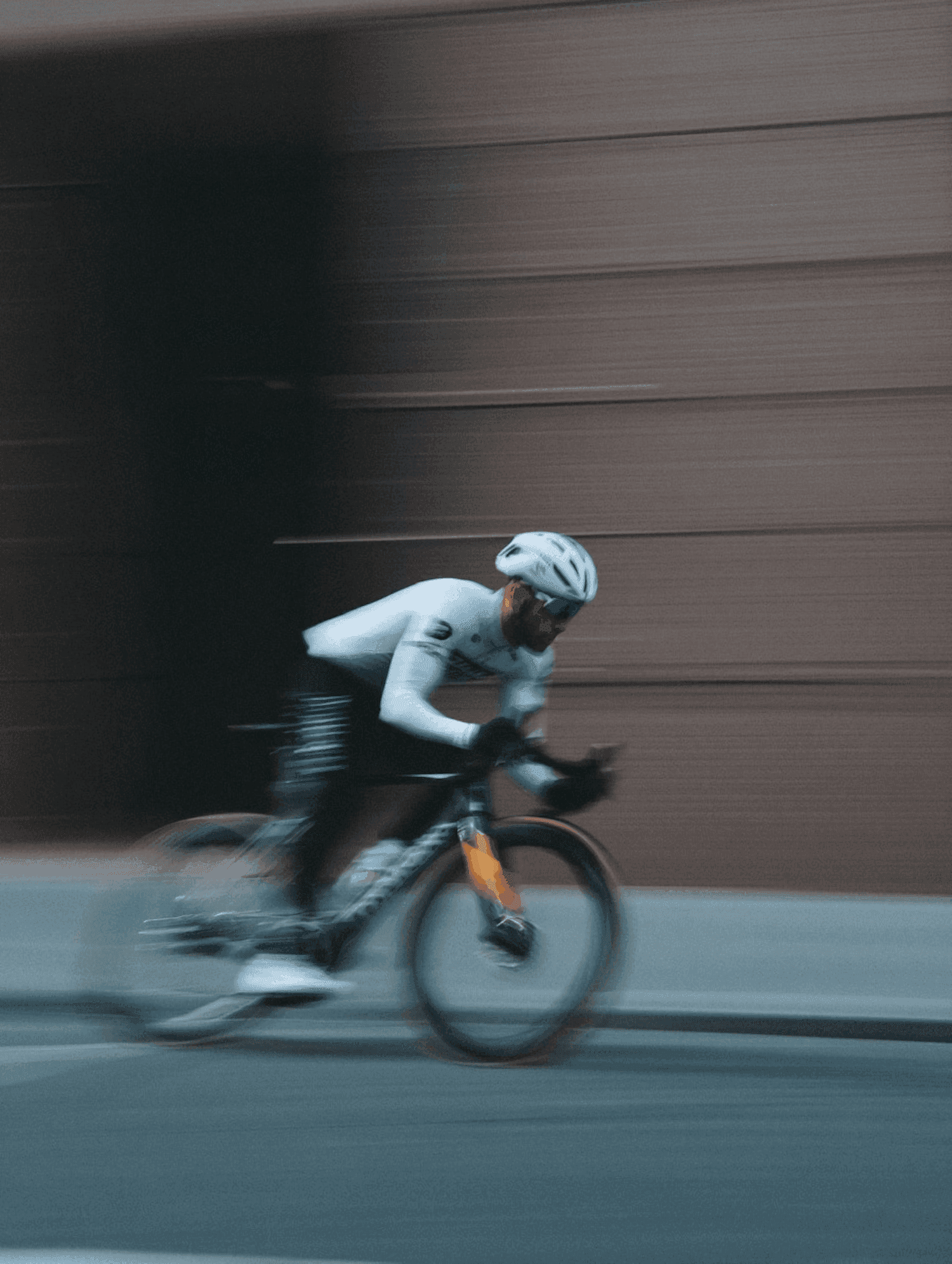 Cyclist riding fast with motion blur representing web design performance and speed