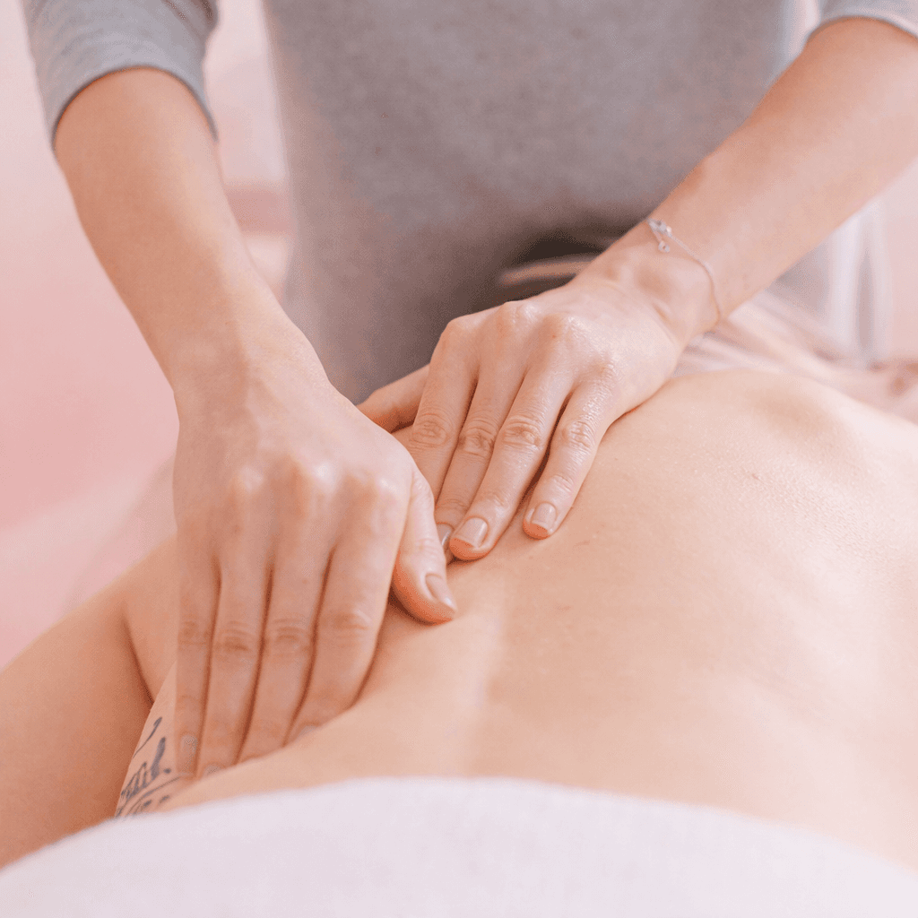 man massaging woman's body