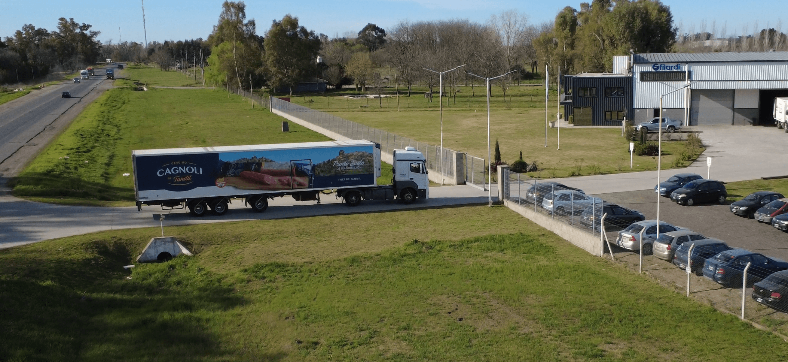 woman holding a phone and man looking at the phone. both are smiling