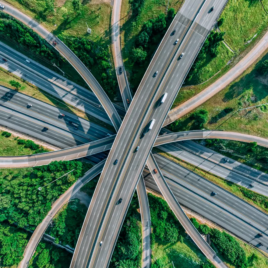 Aerial view of a U.S. highway interchange with commercial trucks in traffic