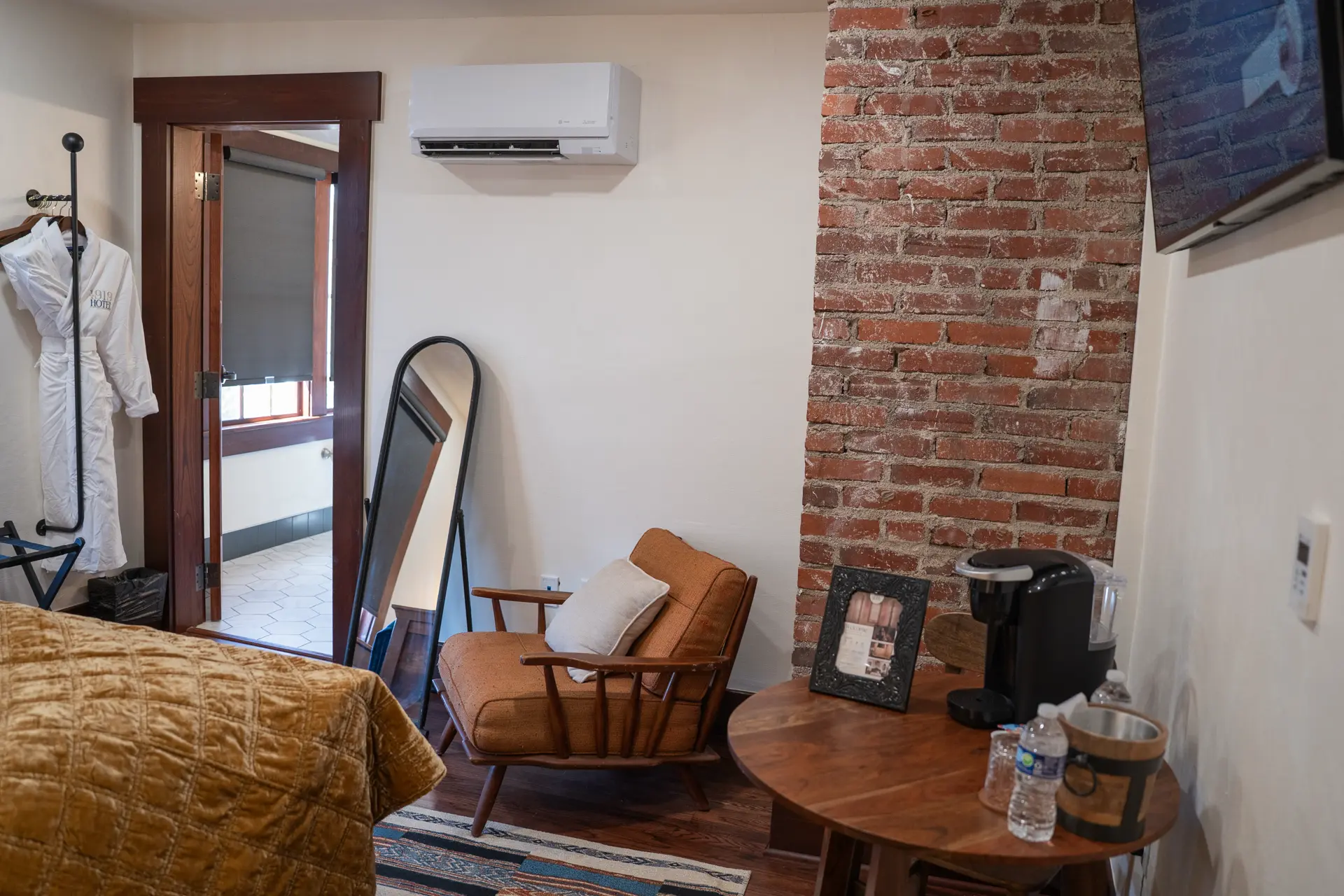 Exposed brick, reading chair and coffee station