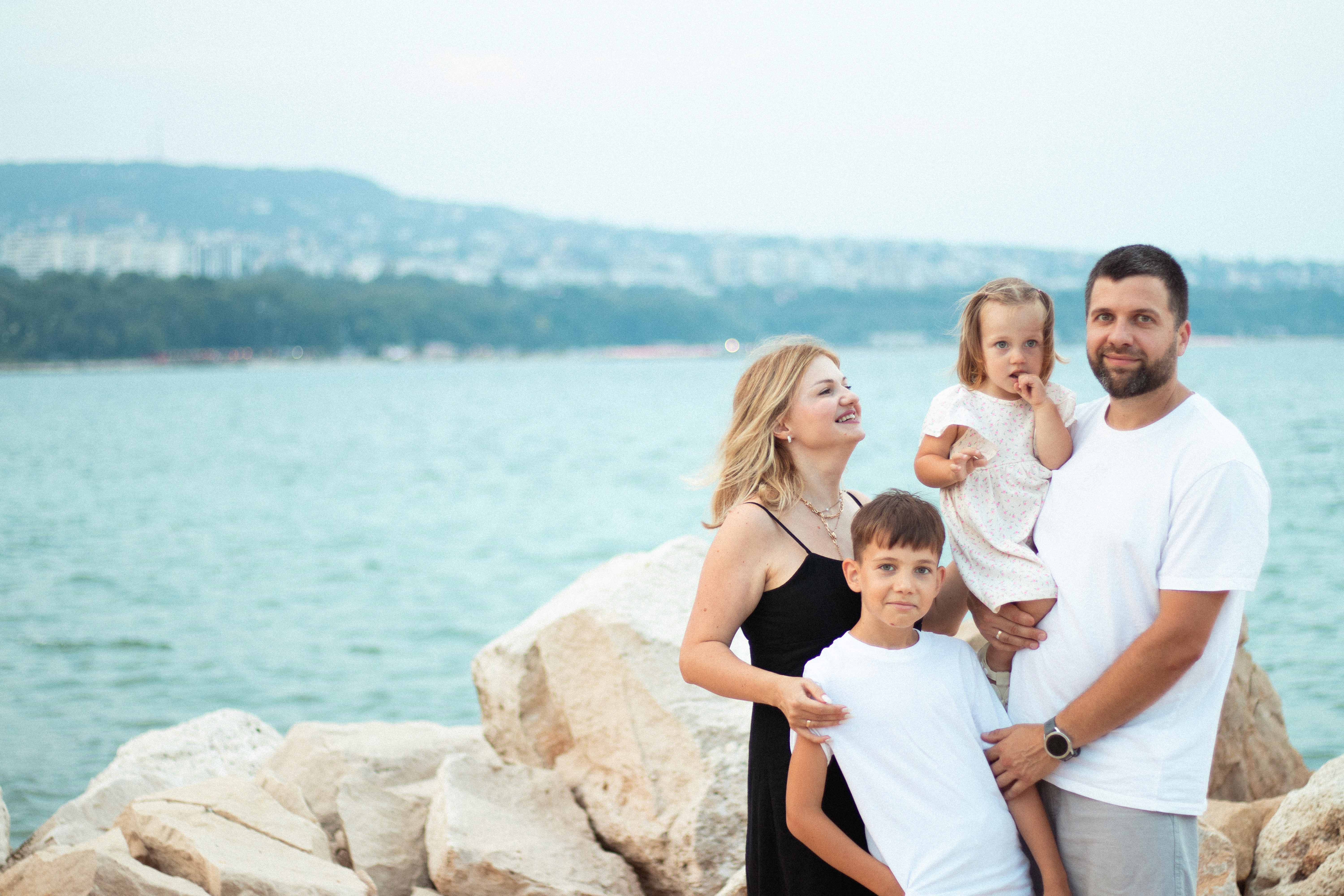 family photo on green grass during golden hour