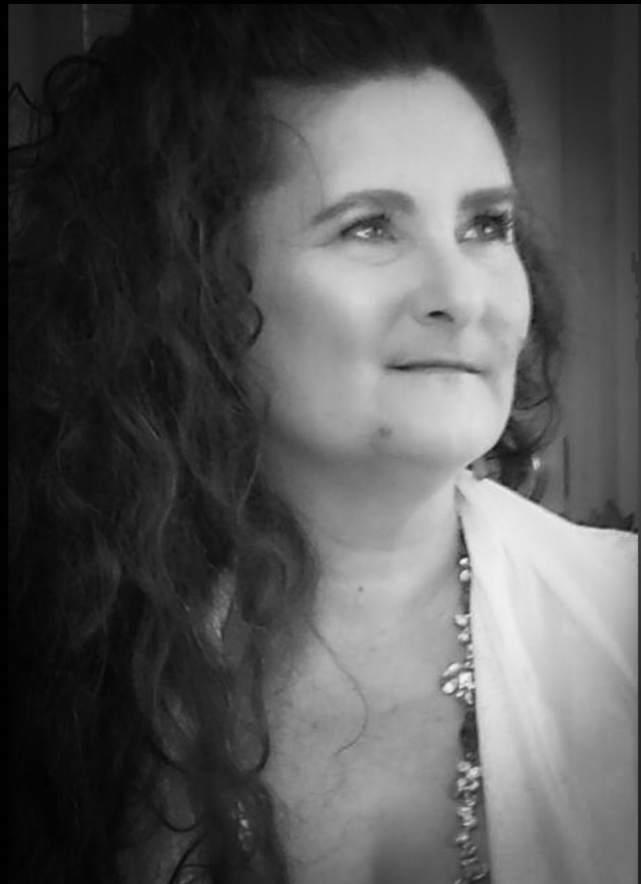 a man in a blue suit posing for a picture