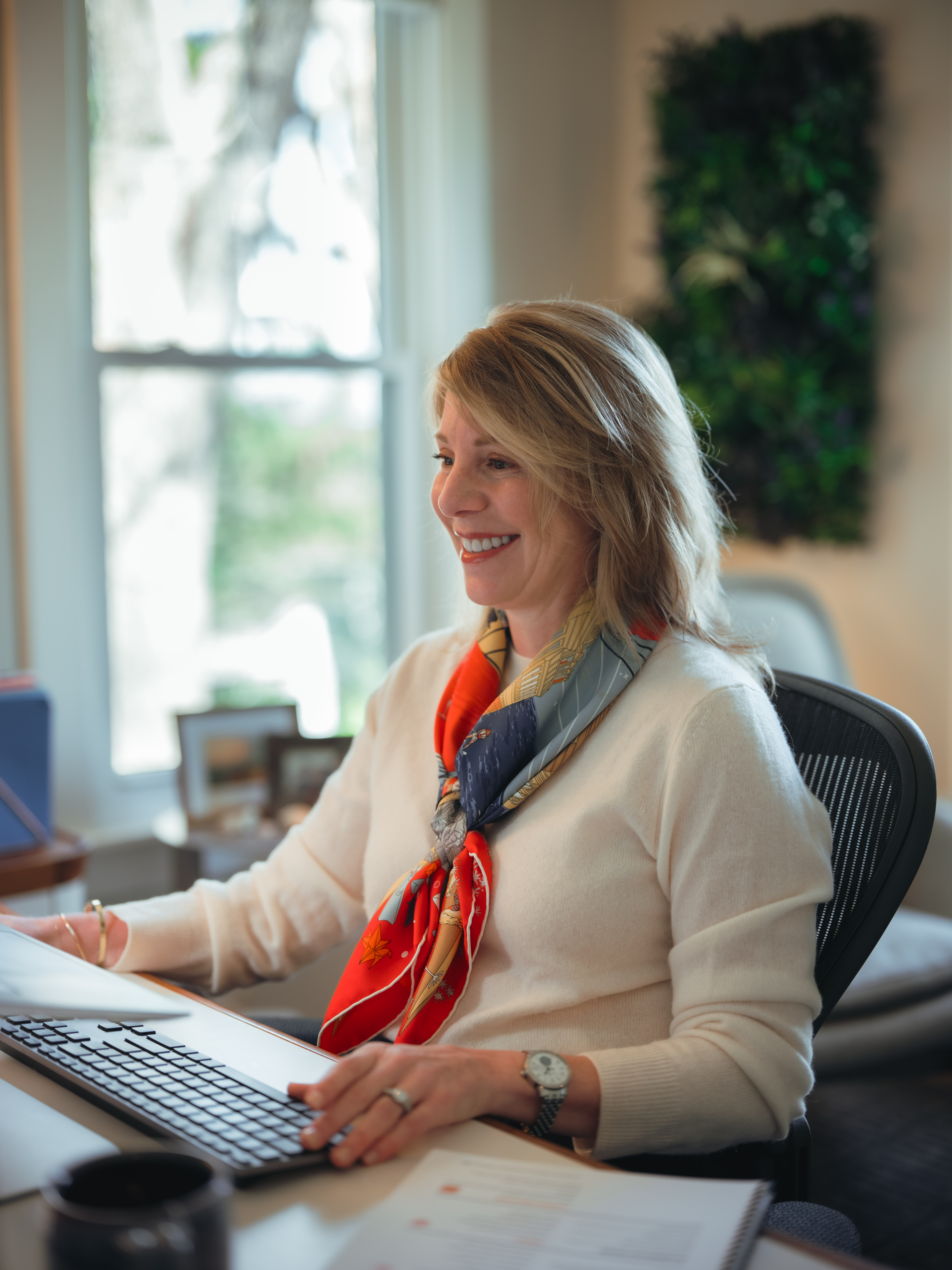 woman sitting at computer desk