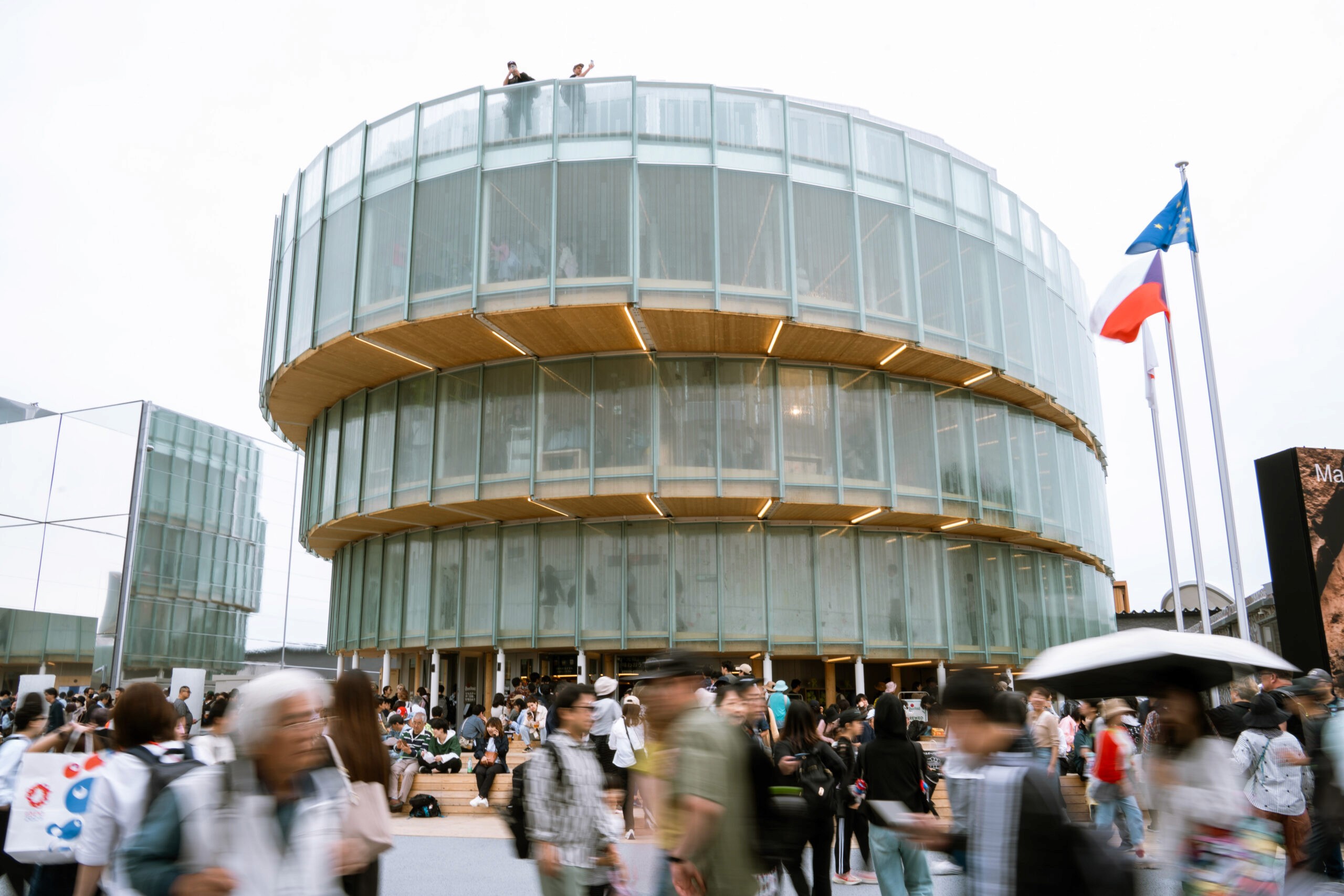 A group of people working and eating together outdoors.