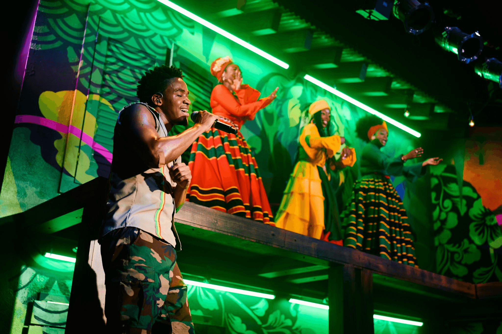 I-3's singing in trench townperformance on top of VW bus