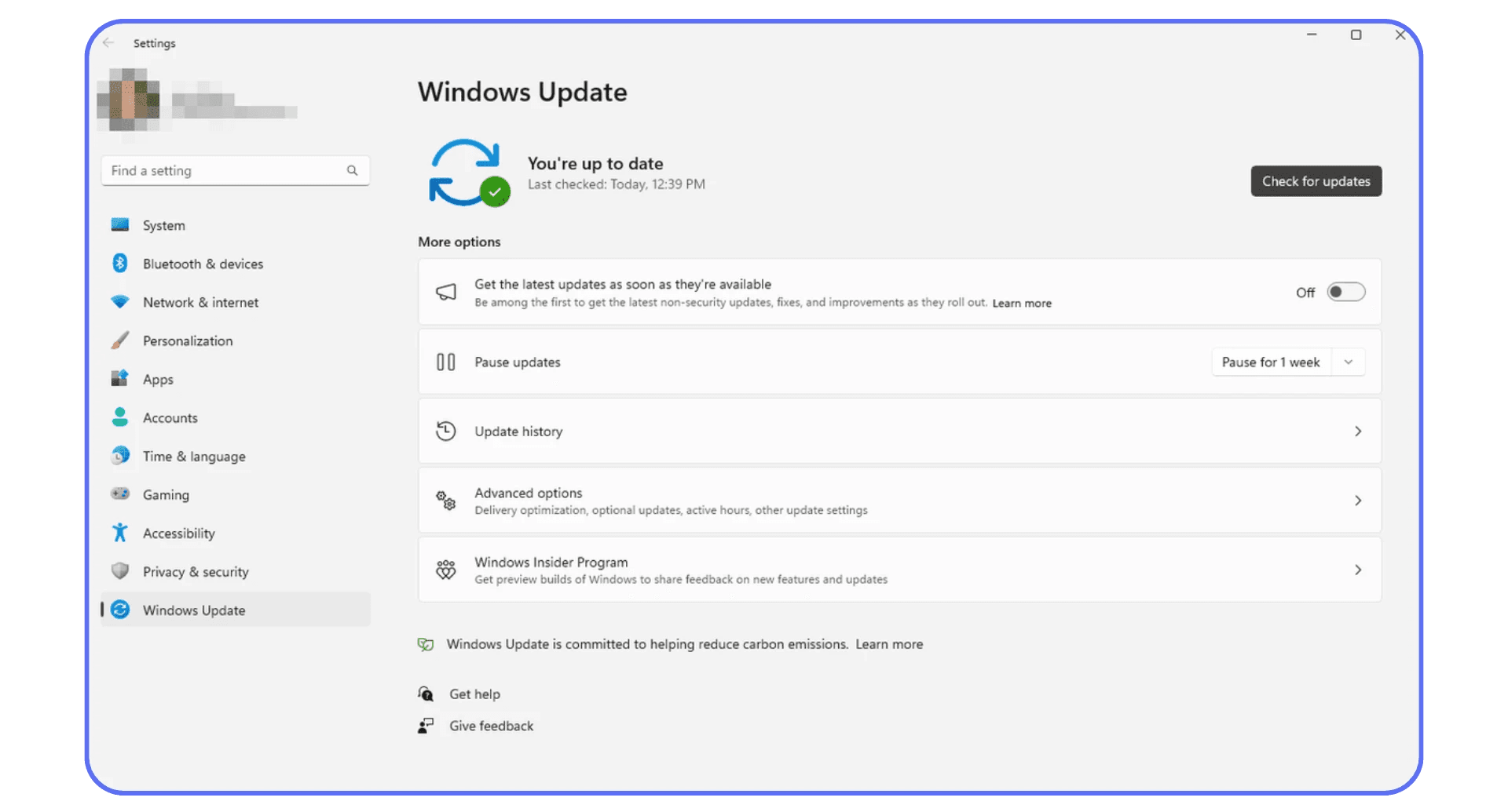Windows 11 Update settings window showing system up to date with options for pausing and managing updates.