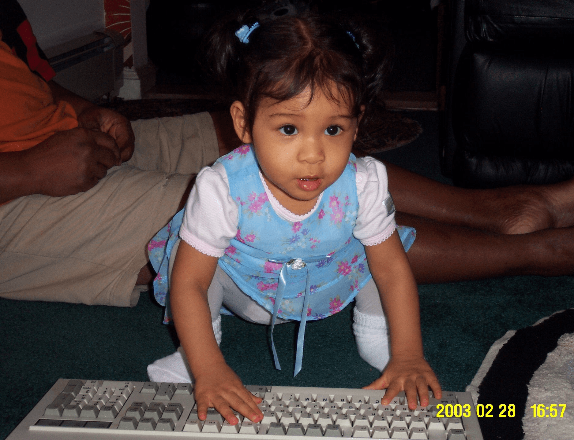 Young Alyssa in 2003, smashing keys on a keyboard in the living room.