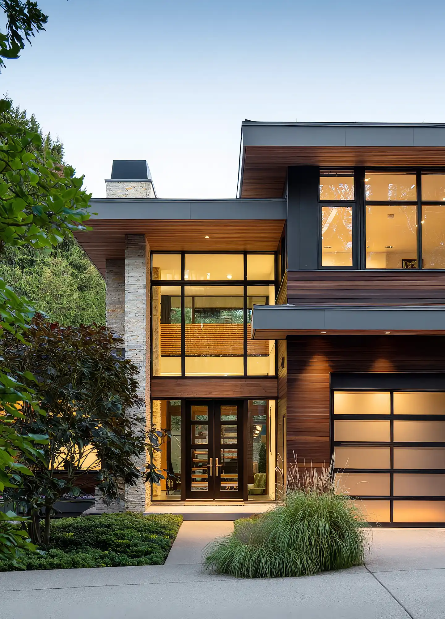 Contemporary home with greenery, lawn, and outdoor pathway