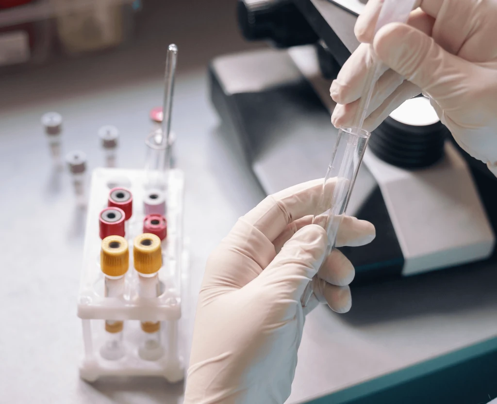 A lab technician prepares samples for analysis