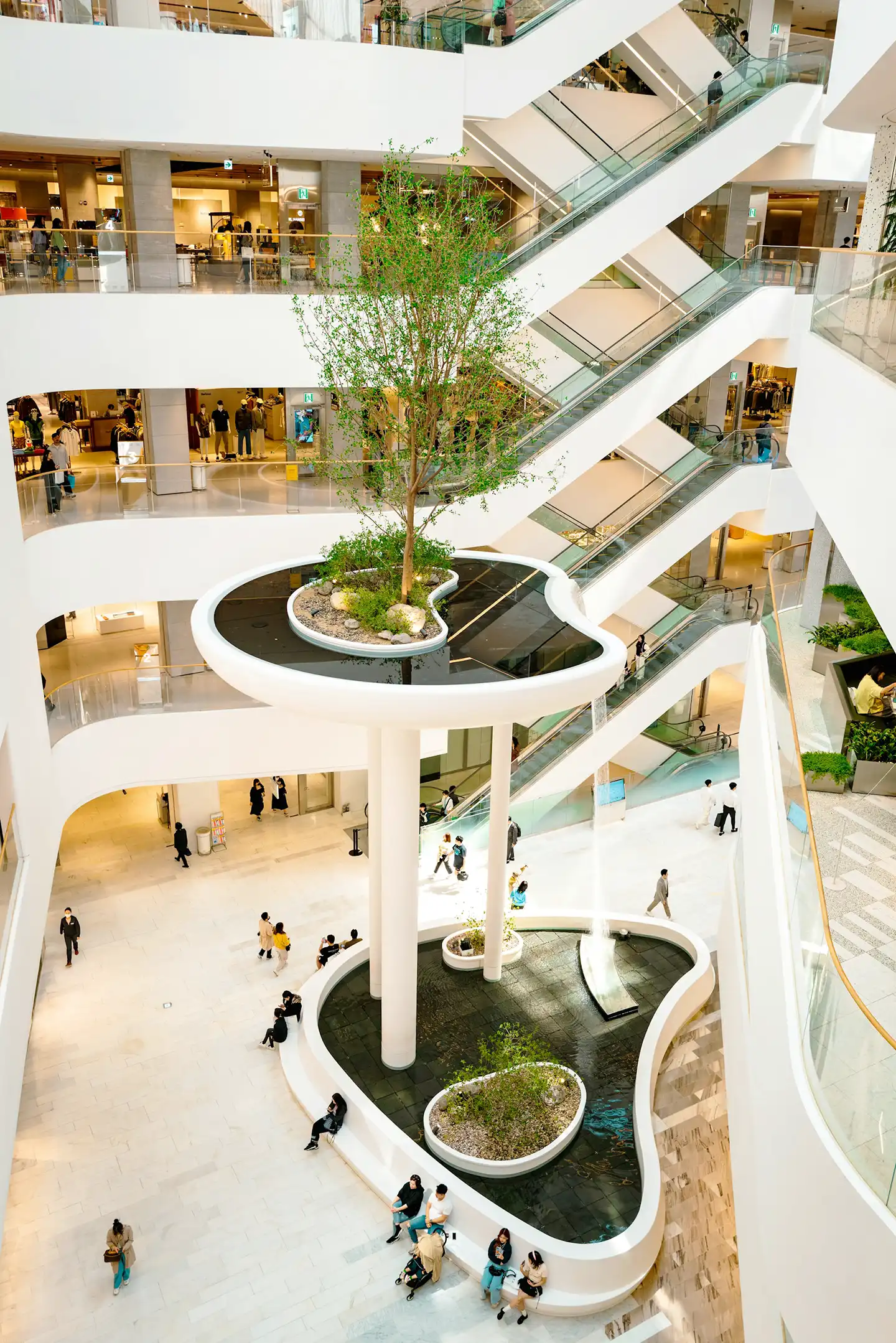 Public area in Dubai with walkways, shops, and modern structures
