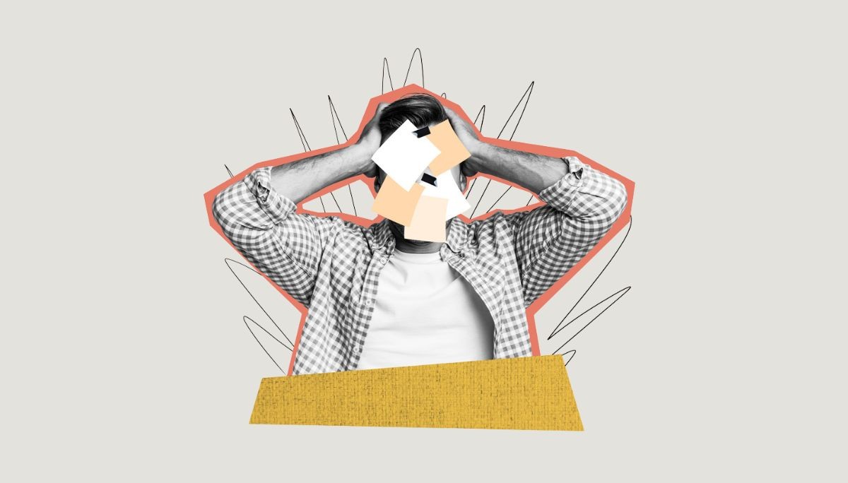 Person with head in hands covered by paper notes, symbolizing startup burnout for founders and employees.
