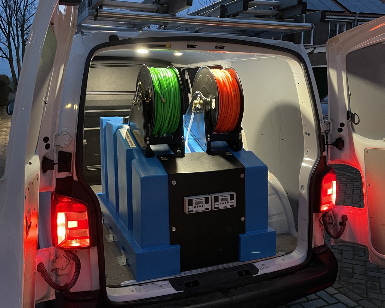 A diverse team collaborates around a table, analyzing documents and charts in a professional setting with a light green background.