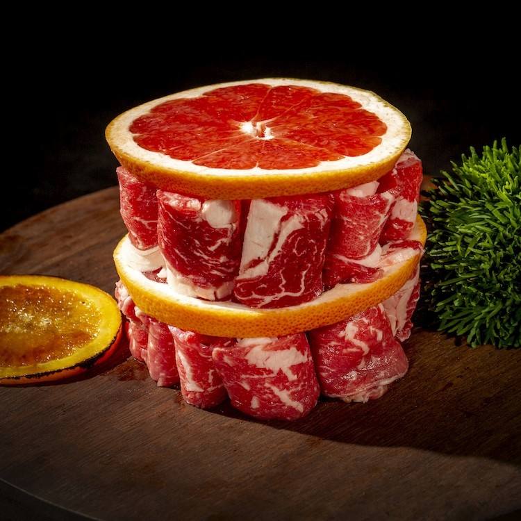 a bunch of food that is on a grill