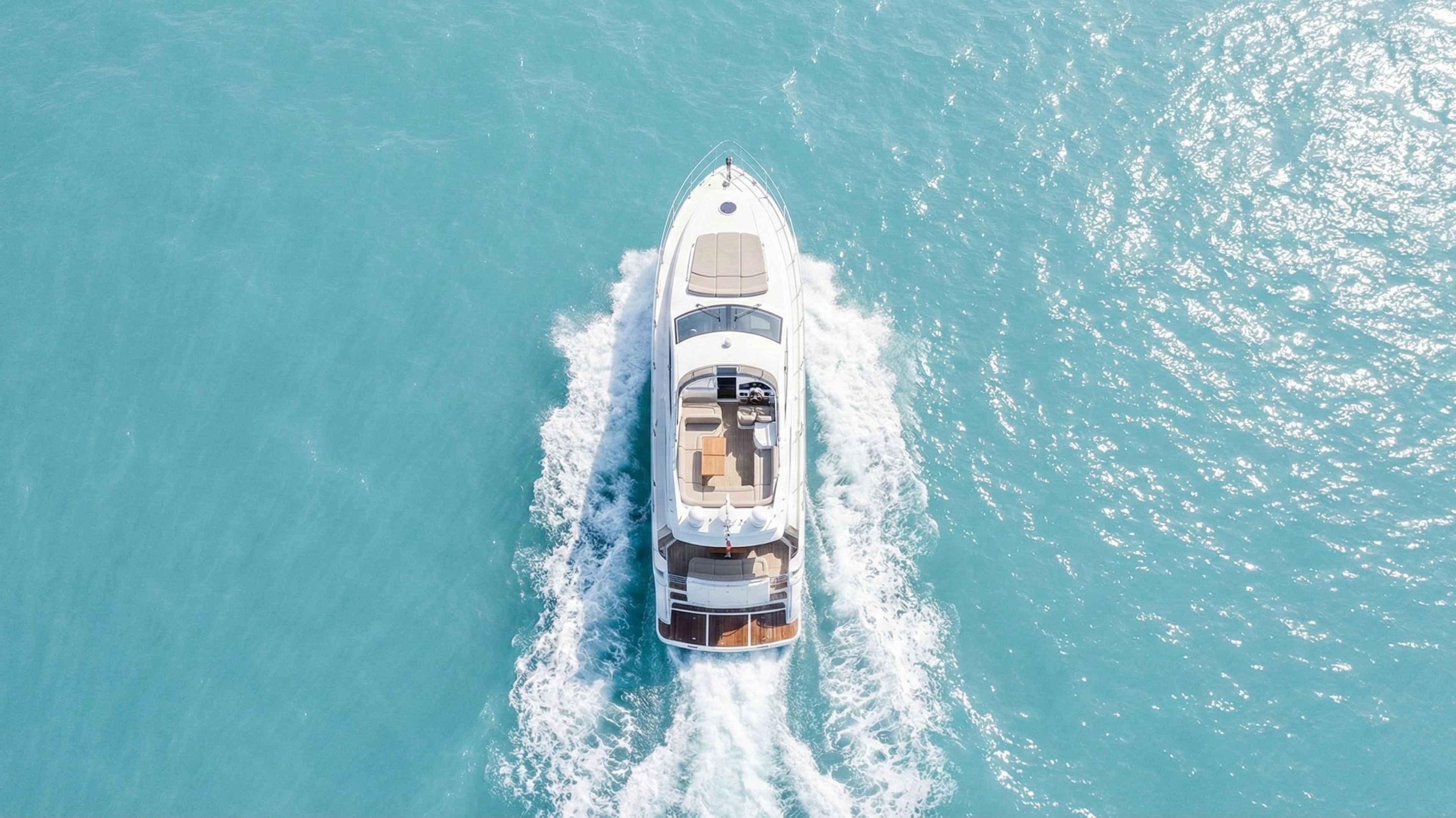 Aerial view of a luxury boat protected with XPEL marine paint protection film cruising in Southern California waters