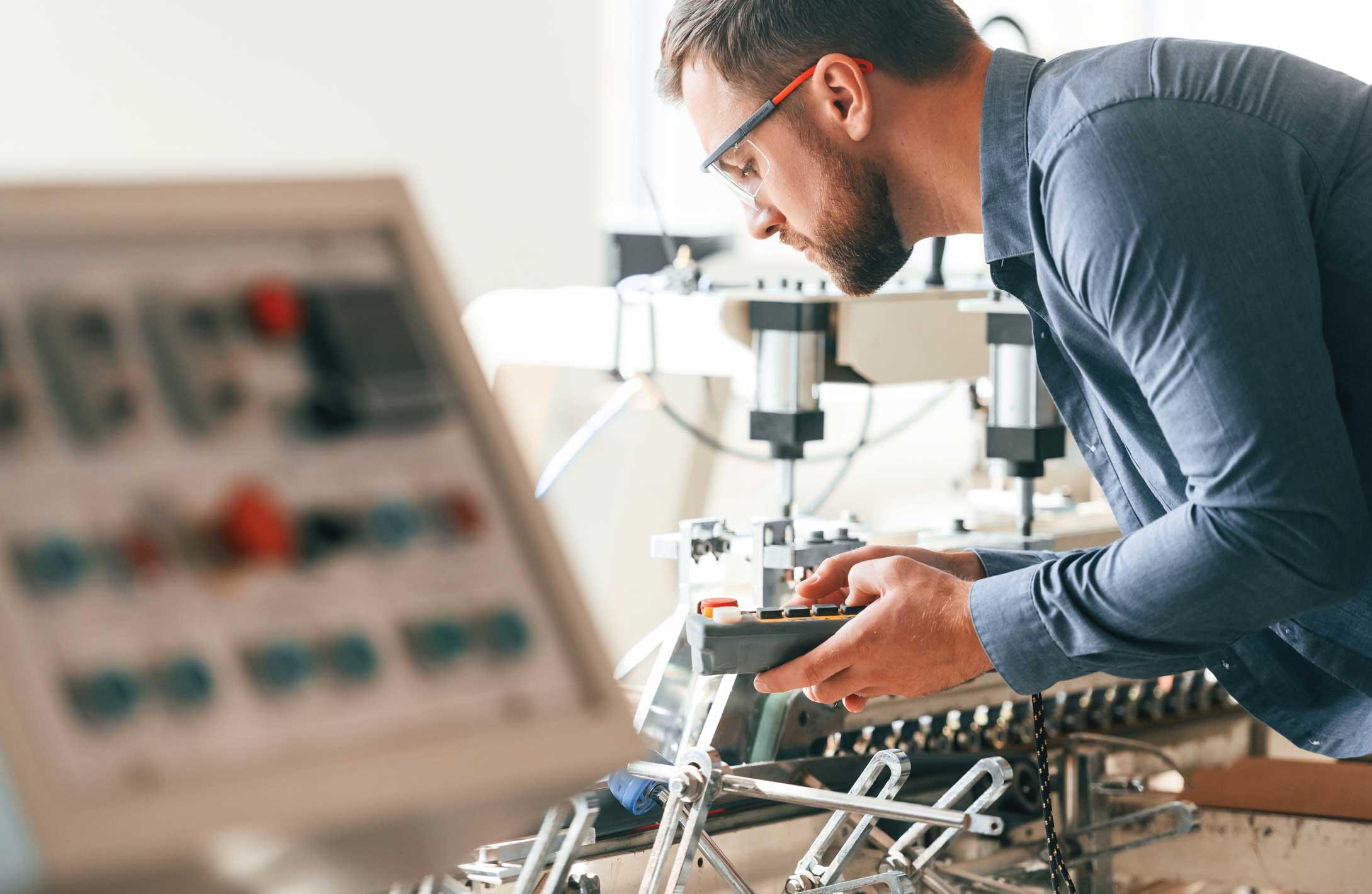 Engineer in factory with machine, technology