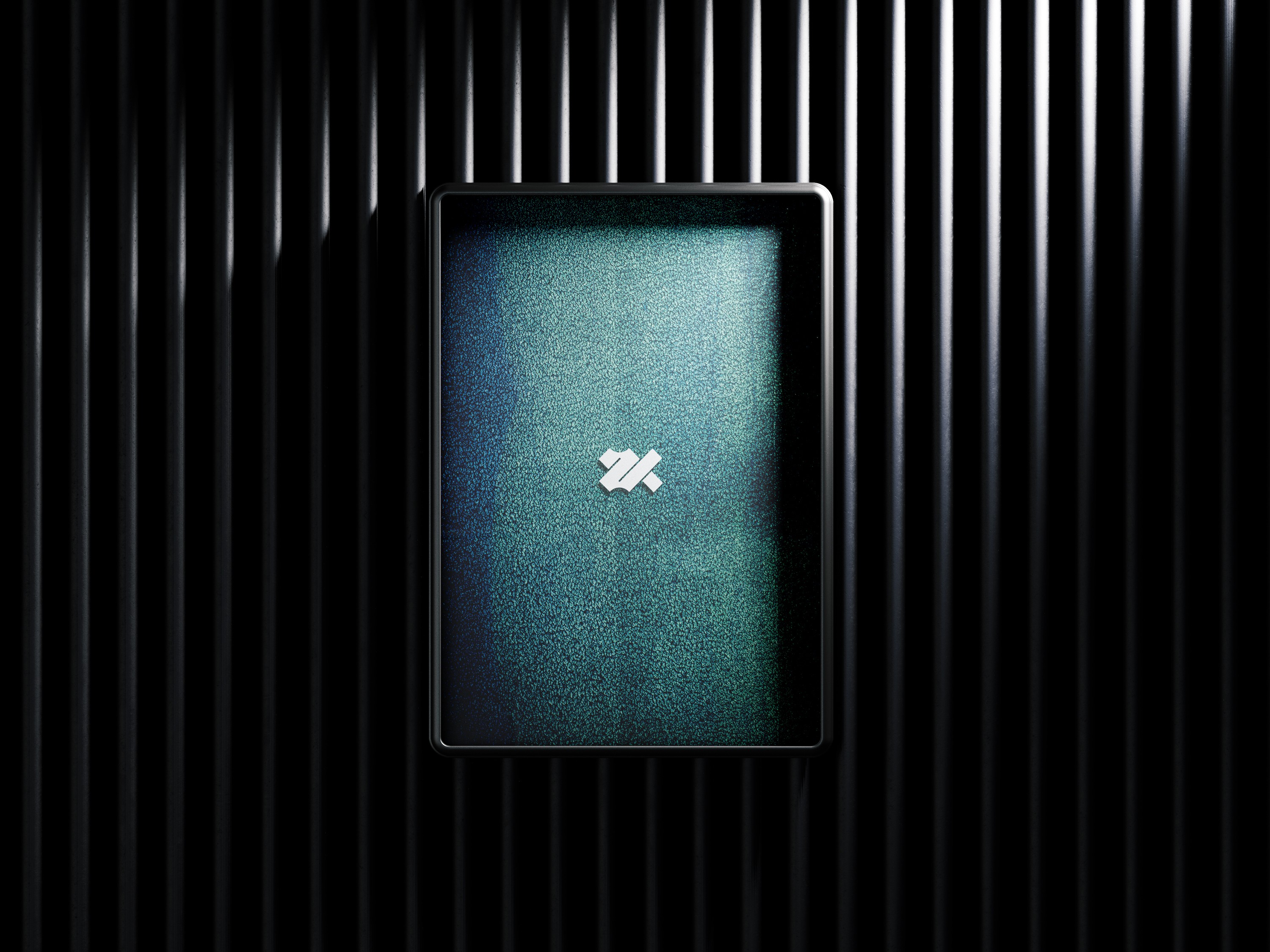 Black cosmetic product bottle against a dark background