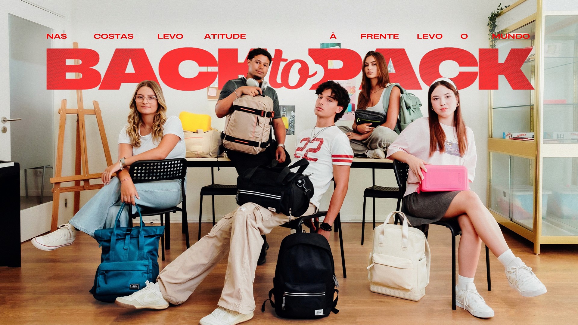 Five students sitting with American Tourister backpacks under bold red 'Back to Pack' campaign headline