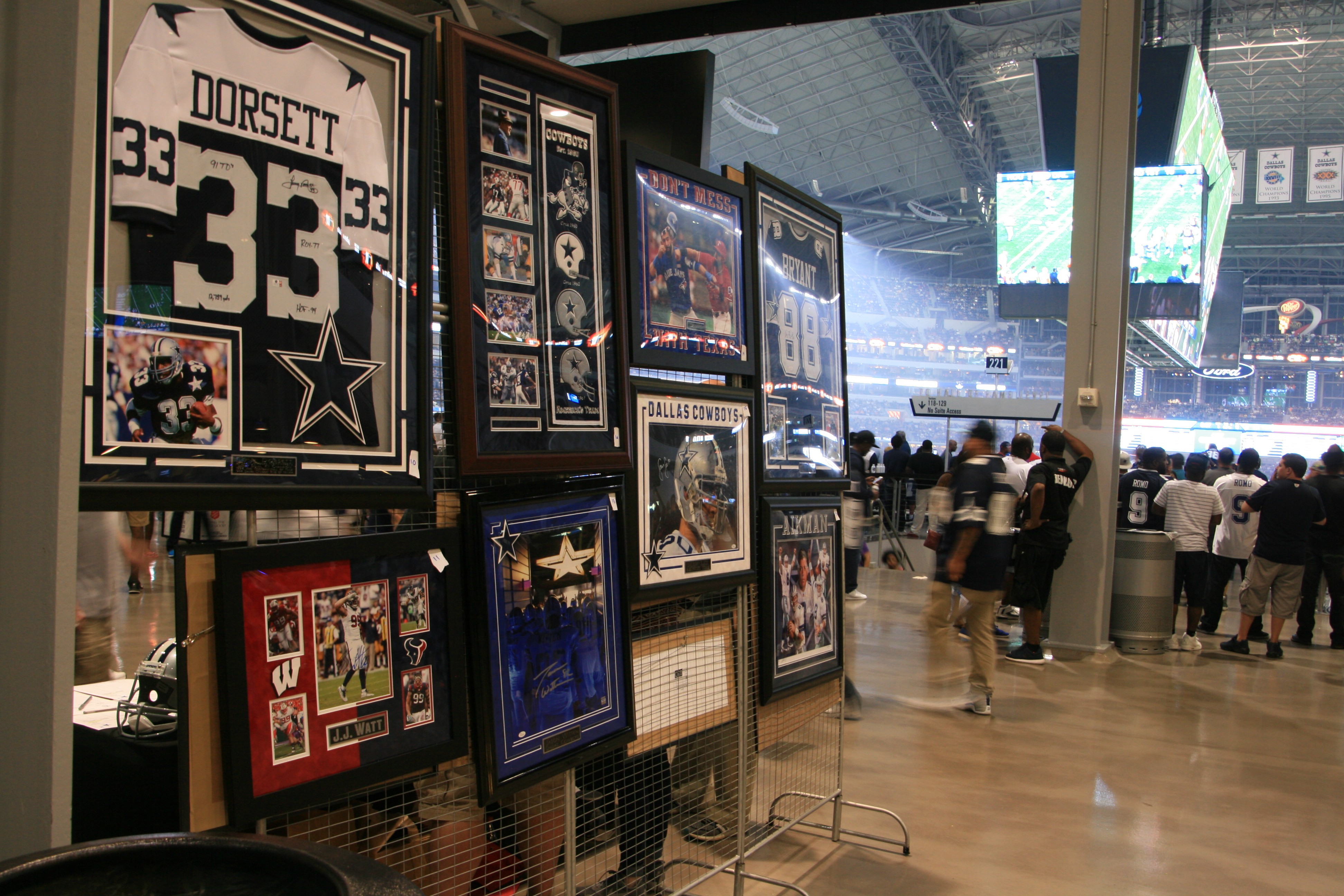 Modern living room with vertical garden, yellow sofas, and stylish coffee tables.