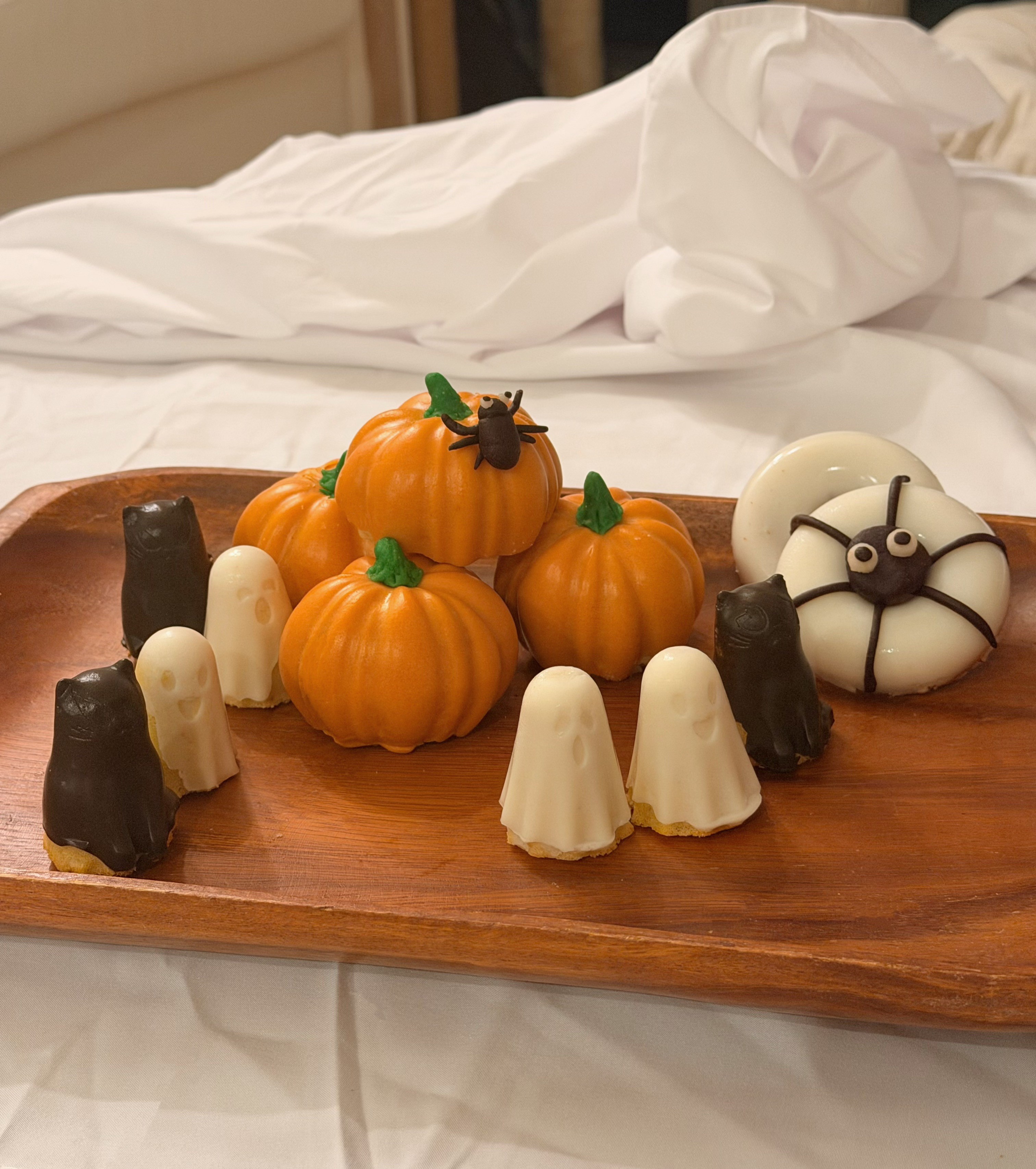 Halloween themed pet treats shaped like pumpkins, ghosts, and seasonal designs