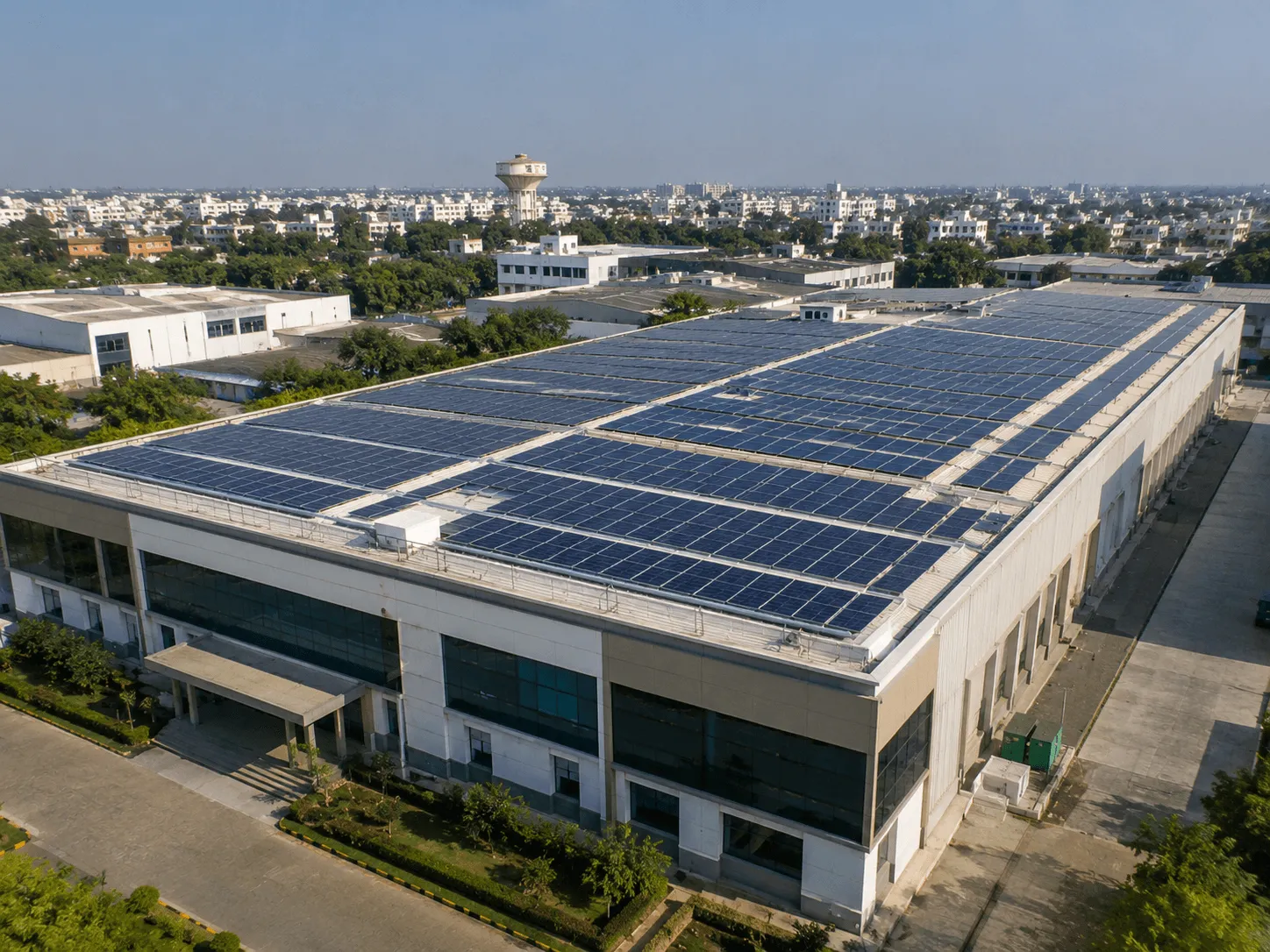 Large commercial building with its rooftop covered in solar panels