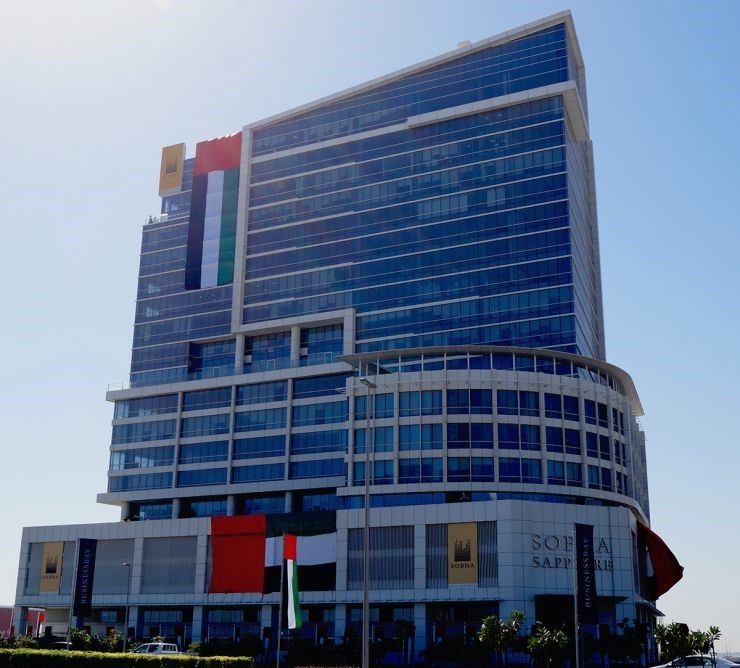 Exterior of a premium Business Bay office building, professional real estate agency property listing.