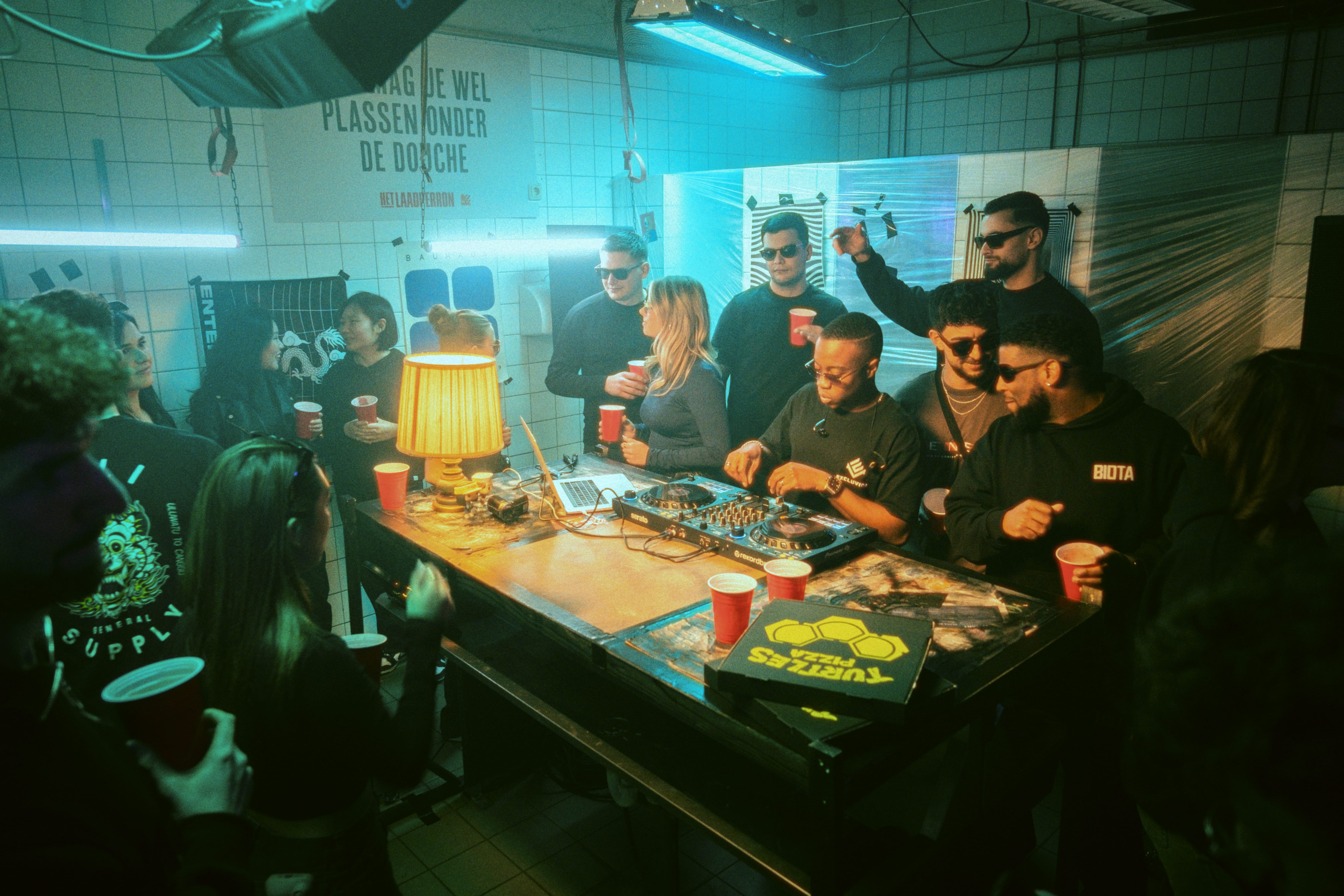 Streetside billboard with flyposters of the Batch.Works brand and illustrations