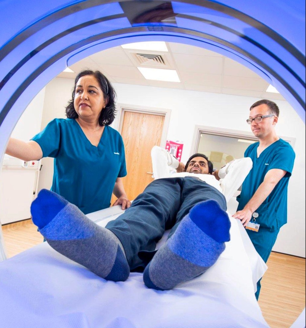 a person going being scanned at the hospital