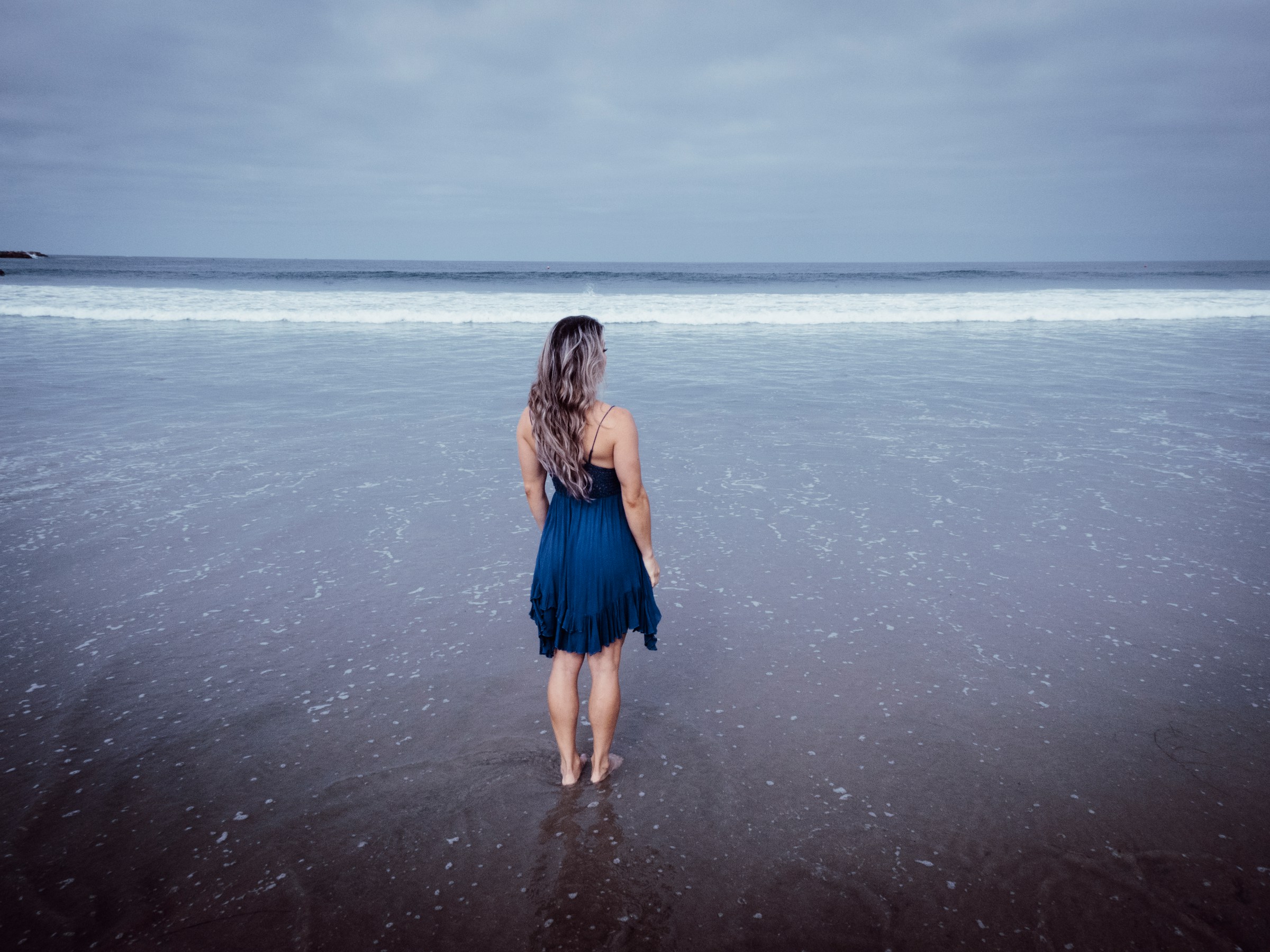 woman on sea view - Colors That Go With Dark Blue