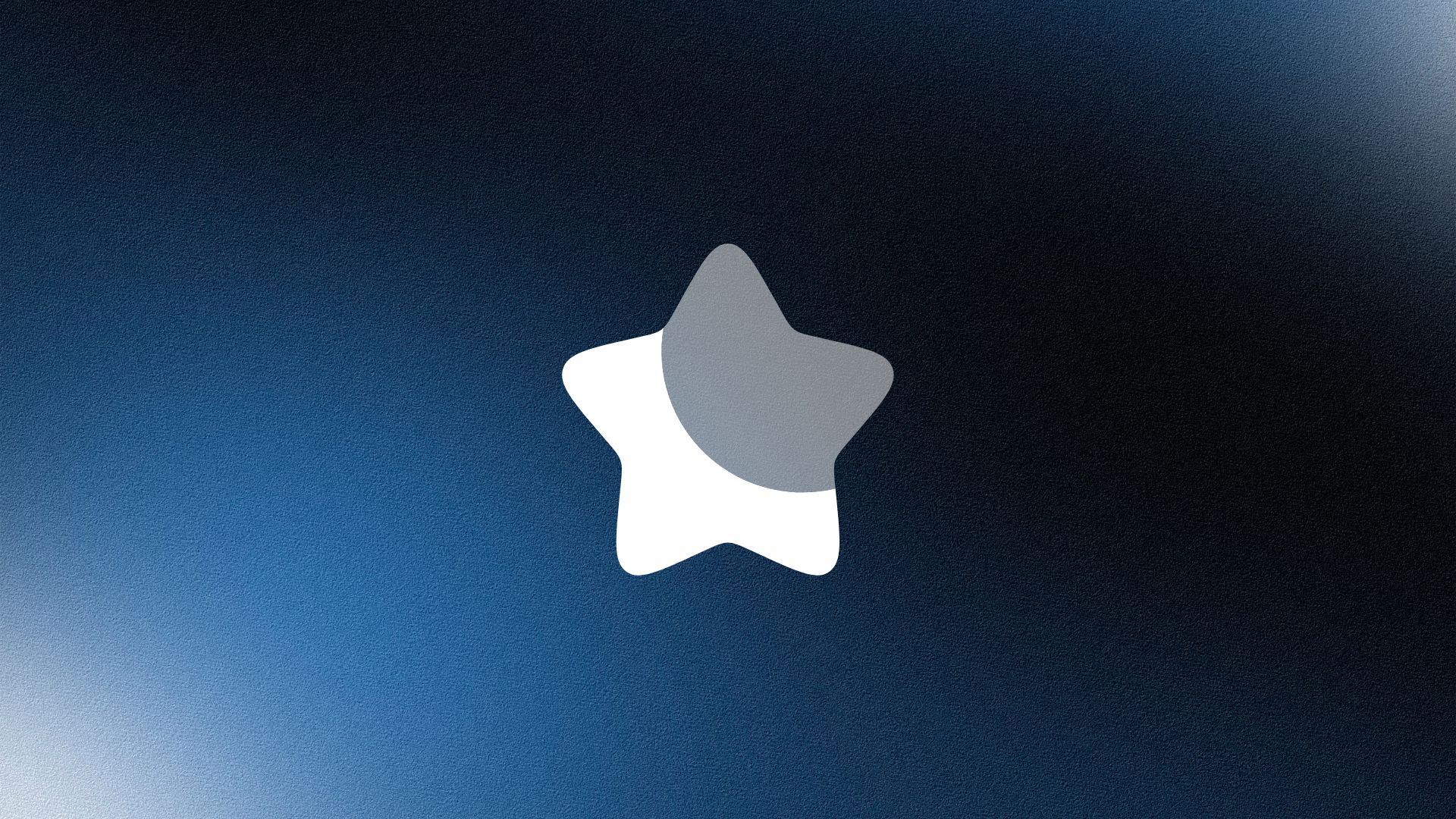 Man wearing a beige cap and dark shirt working on a laptop at a wooden desk with a plant in the background.