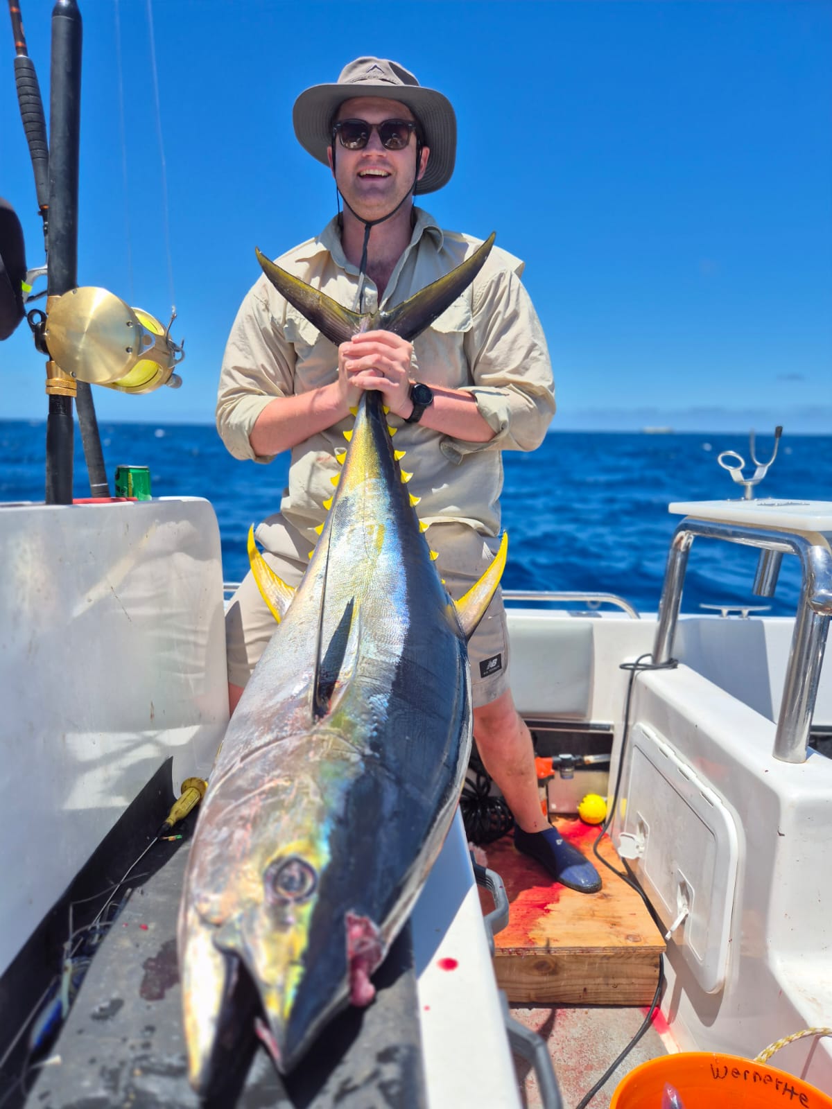 Fishermen celebrating a successful catch on a Salt Safari charter.