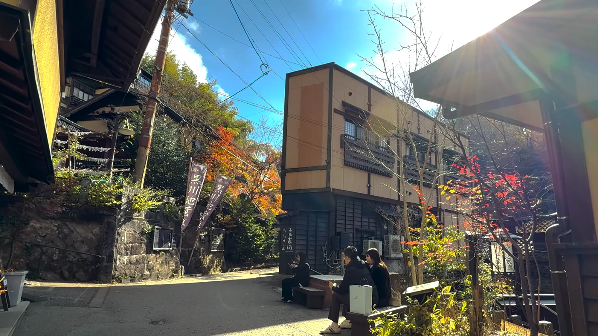 A village lane between timber buildings in autumn, Kurokawa