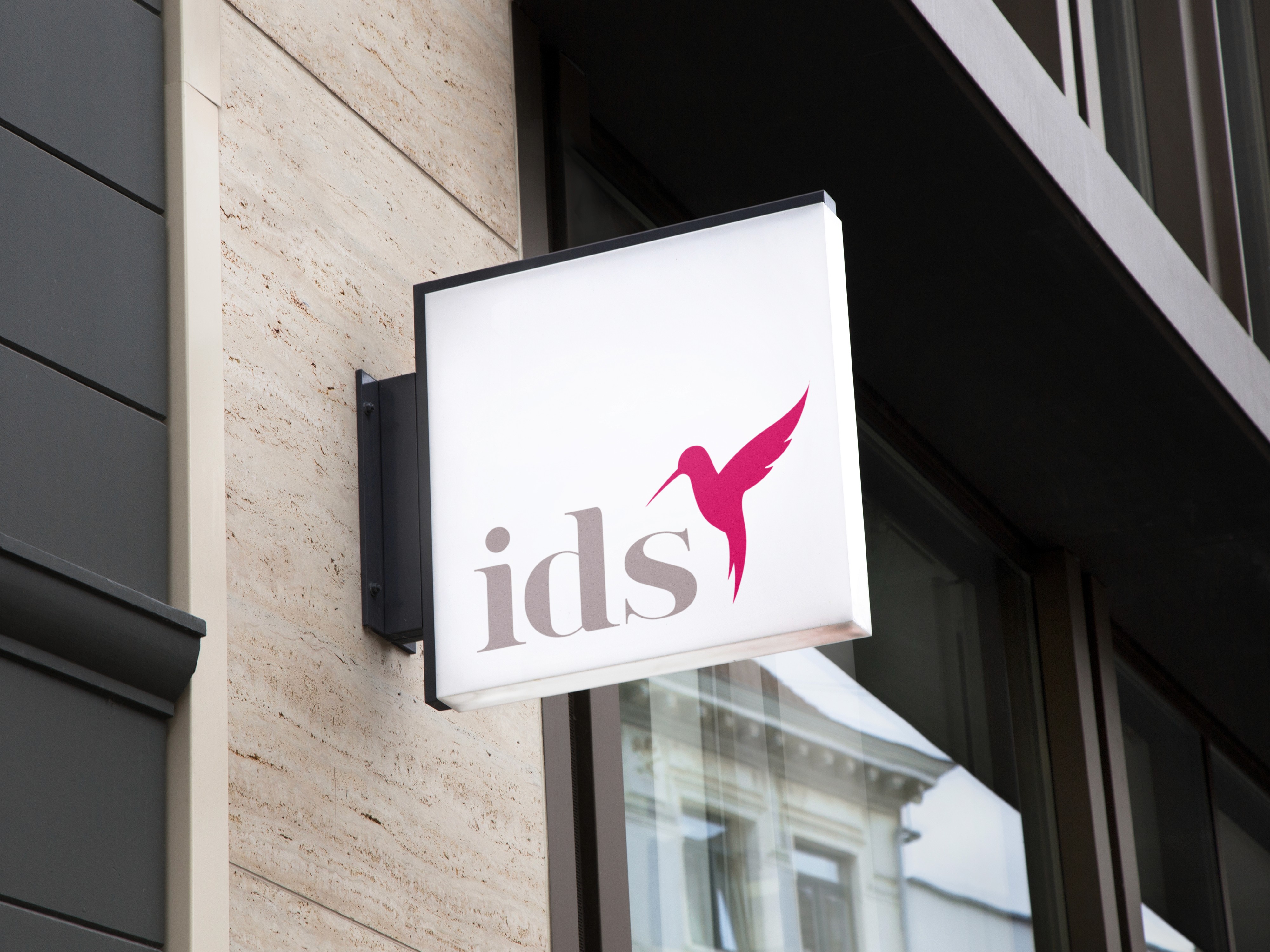 IDS logo on illuminated sign