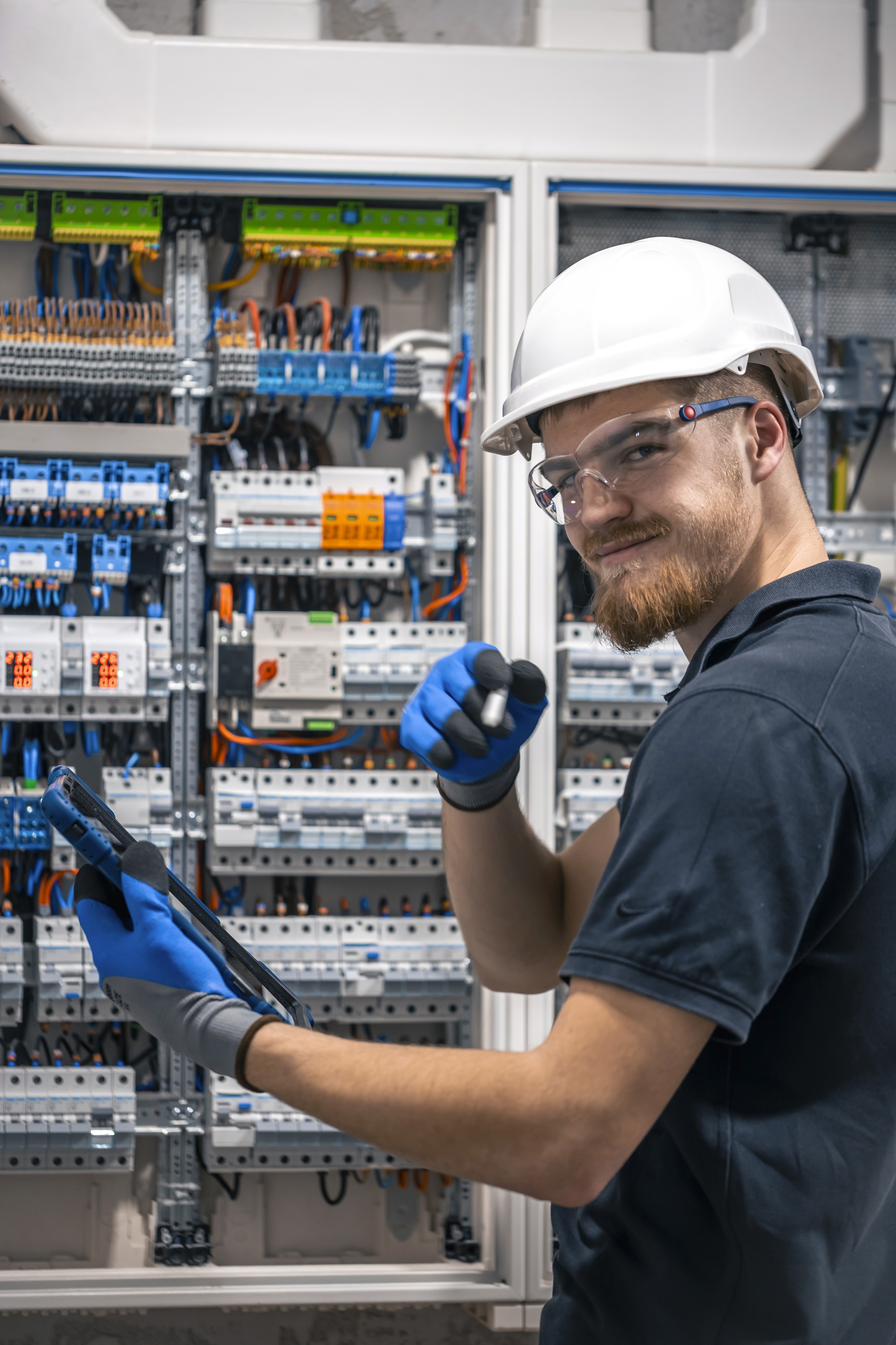 Close-up of a dark green leaf showing its textured surface and central vein against a muted background.