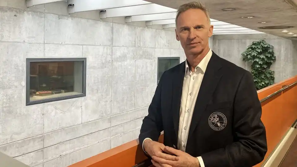 Man in formal jacket indoors