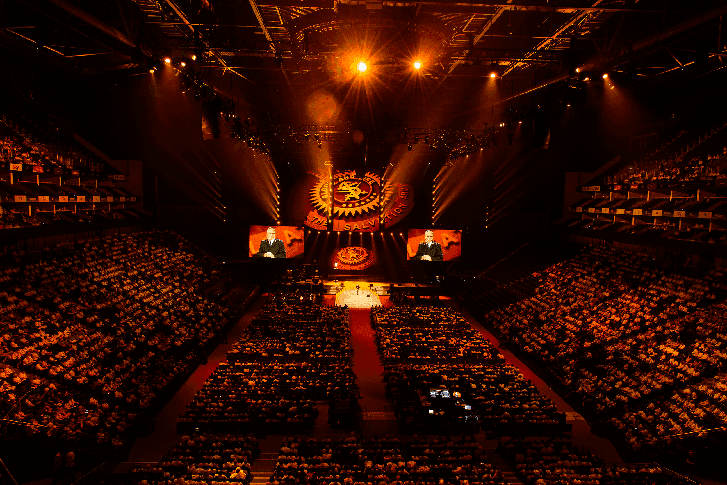 Salvation Army 150th Anniversary with thousands of attendees sitting in the O2 arena
