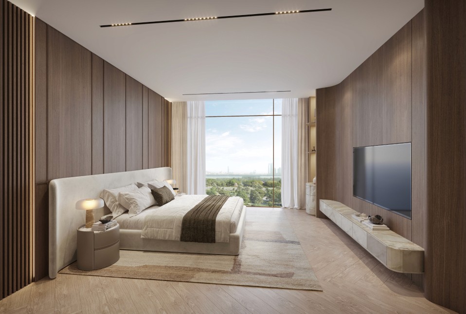 A modern bedroom offering a captivating view of the water through a large window, designed in The Caden by Prescott.