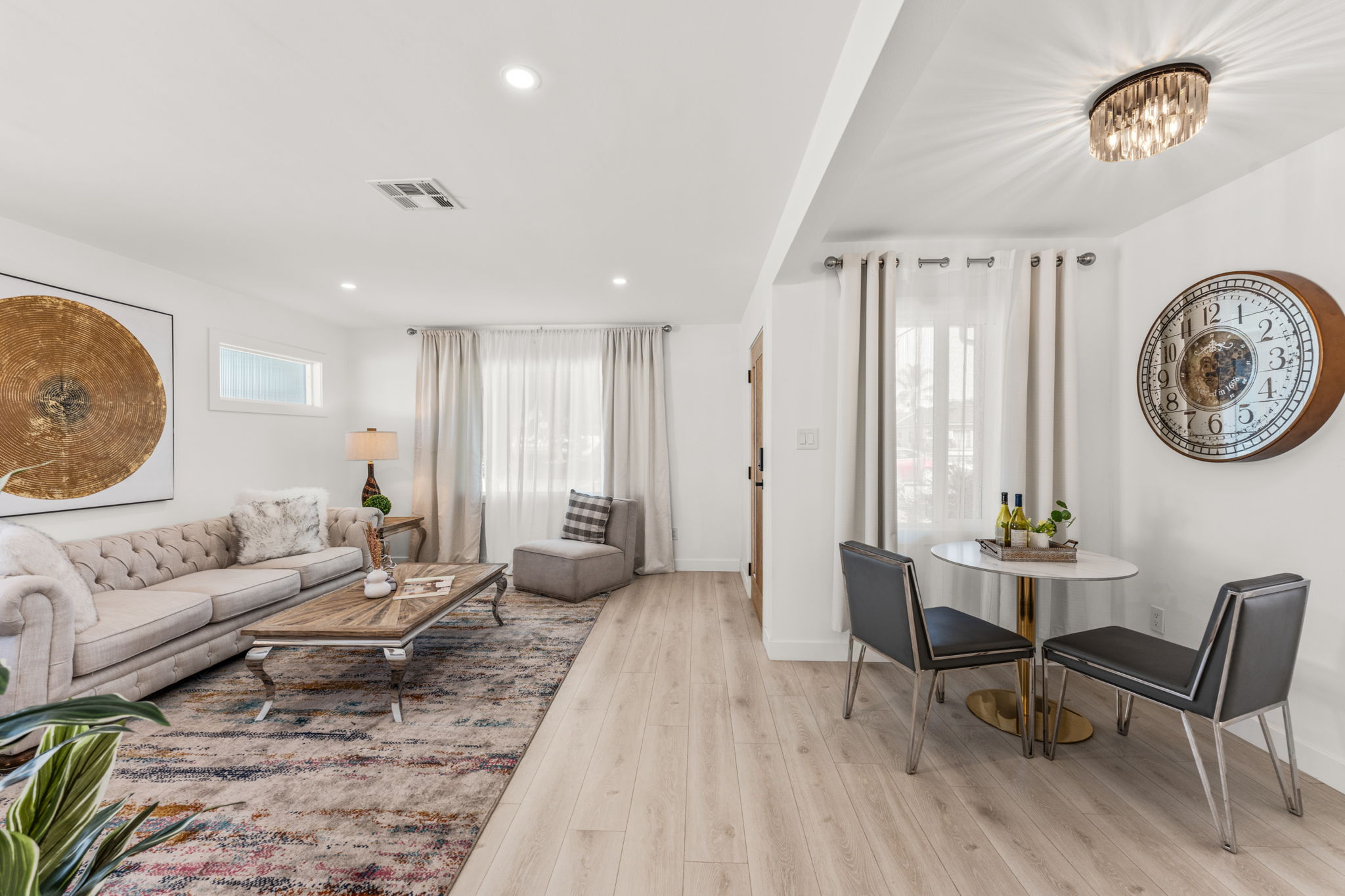 brown and white concrete house near green grass field during daytime